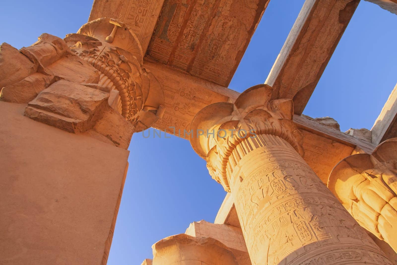 Columns at the Temples of Karnak.  Blue sky in the background. Luxor, Egypt.