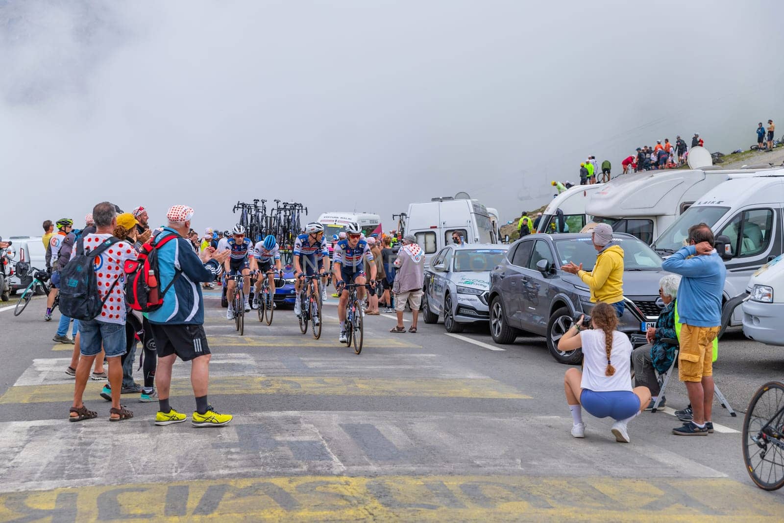 Col du Tourmalet, France - July 06 2023: Soudal Quick-Step Team climbig the road to Col du Tourmalet in Pyerenees mountains during the stage 6 of Le Tour de France 2023.