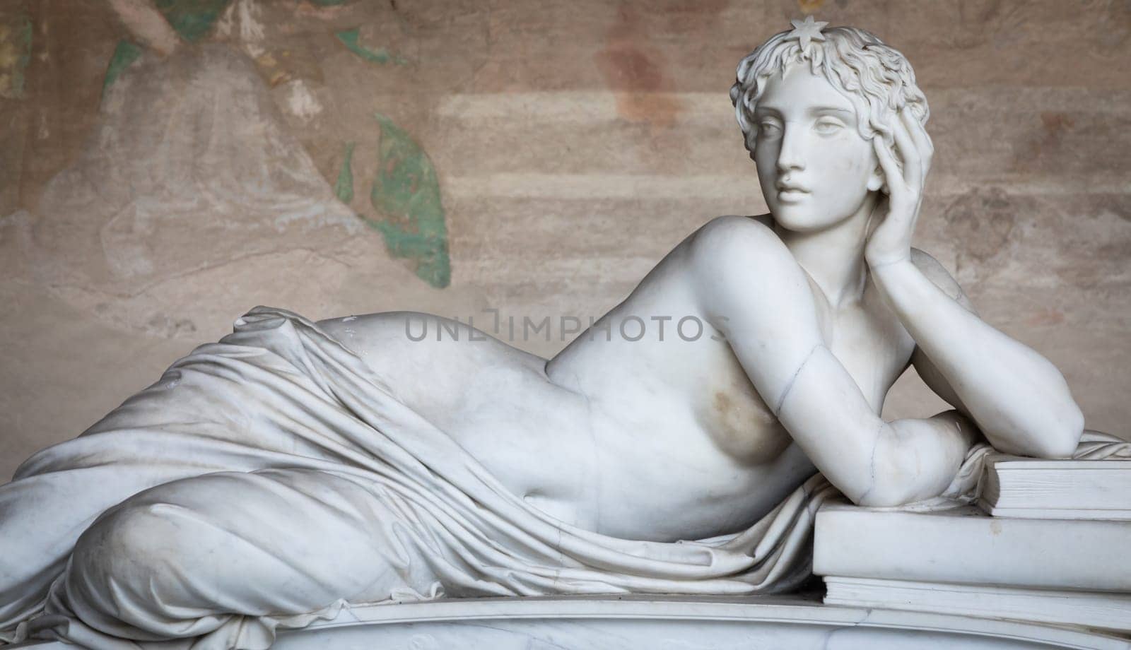 Pisa, Italy - 29 June 2023: sad statue in cemetery. Vintage white marble sculpture, woman sorrow