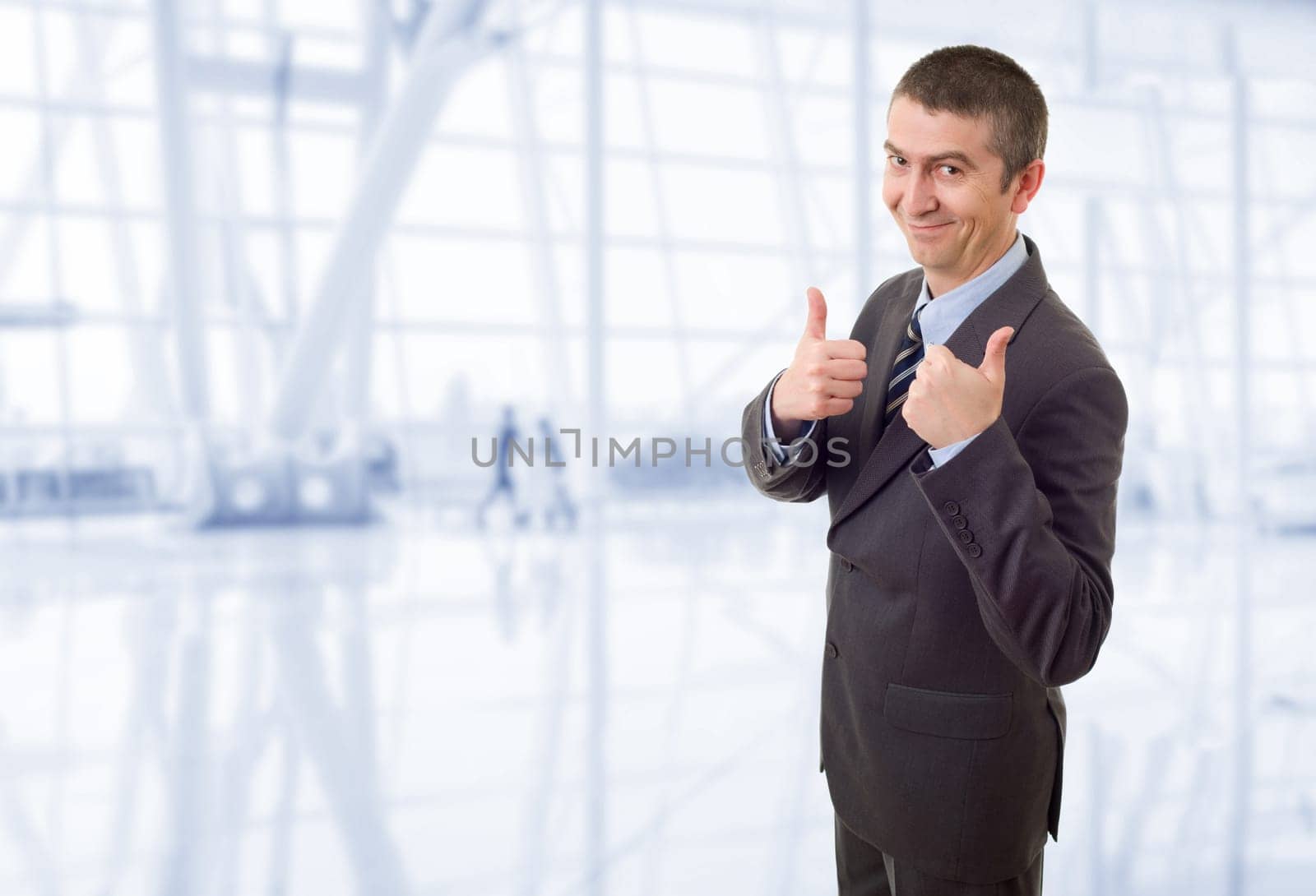happy business man going thumb up, at the office