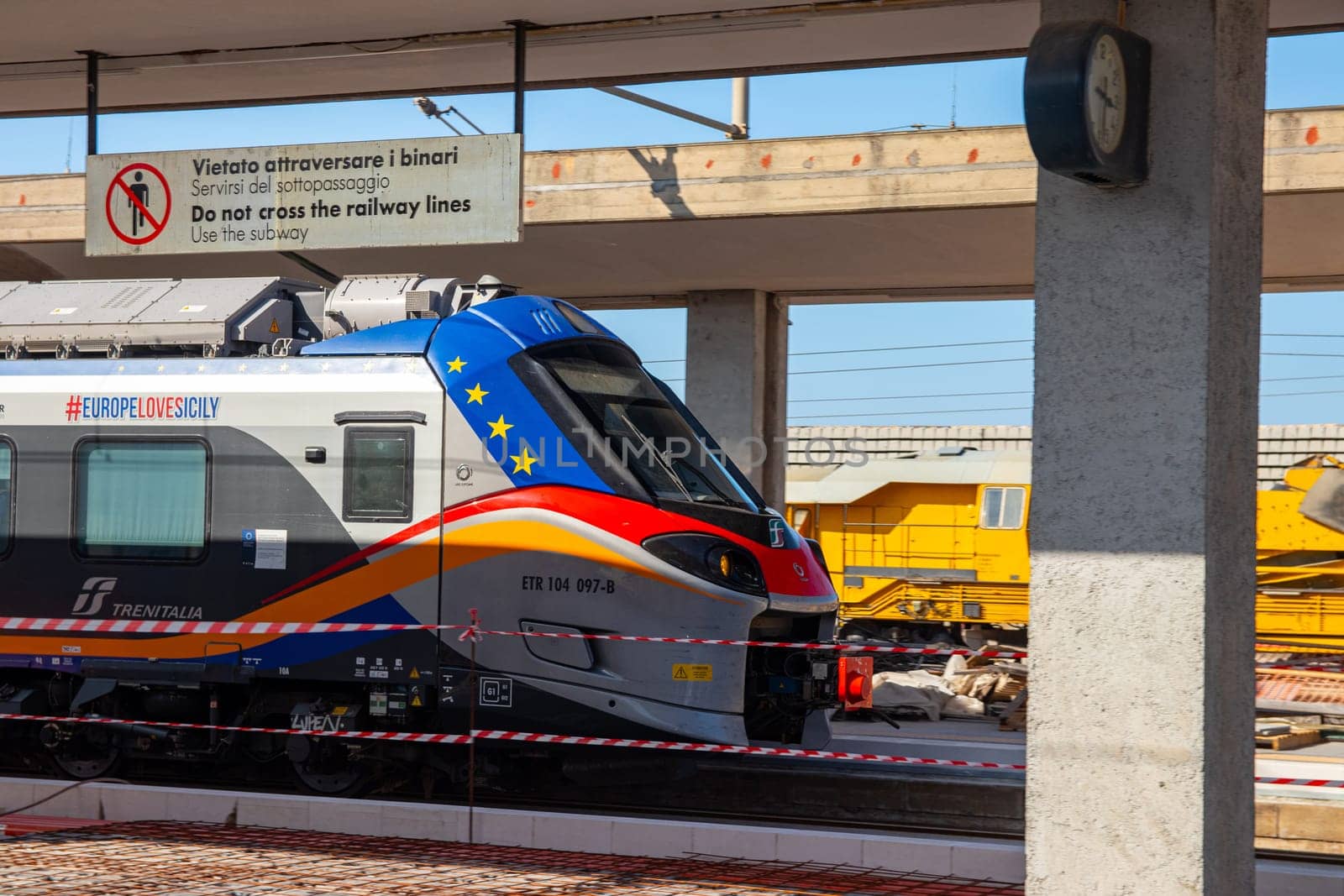 Milazzo, Sicily, Italy - 03 October 2023. A Trenitalia train departing Milazzo station for the onward journey to Palermo Central.