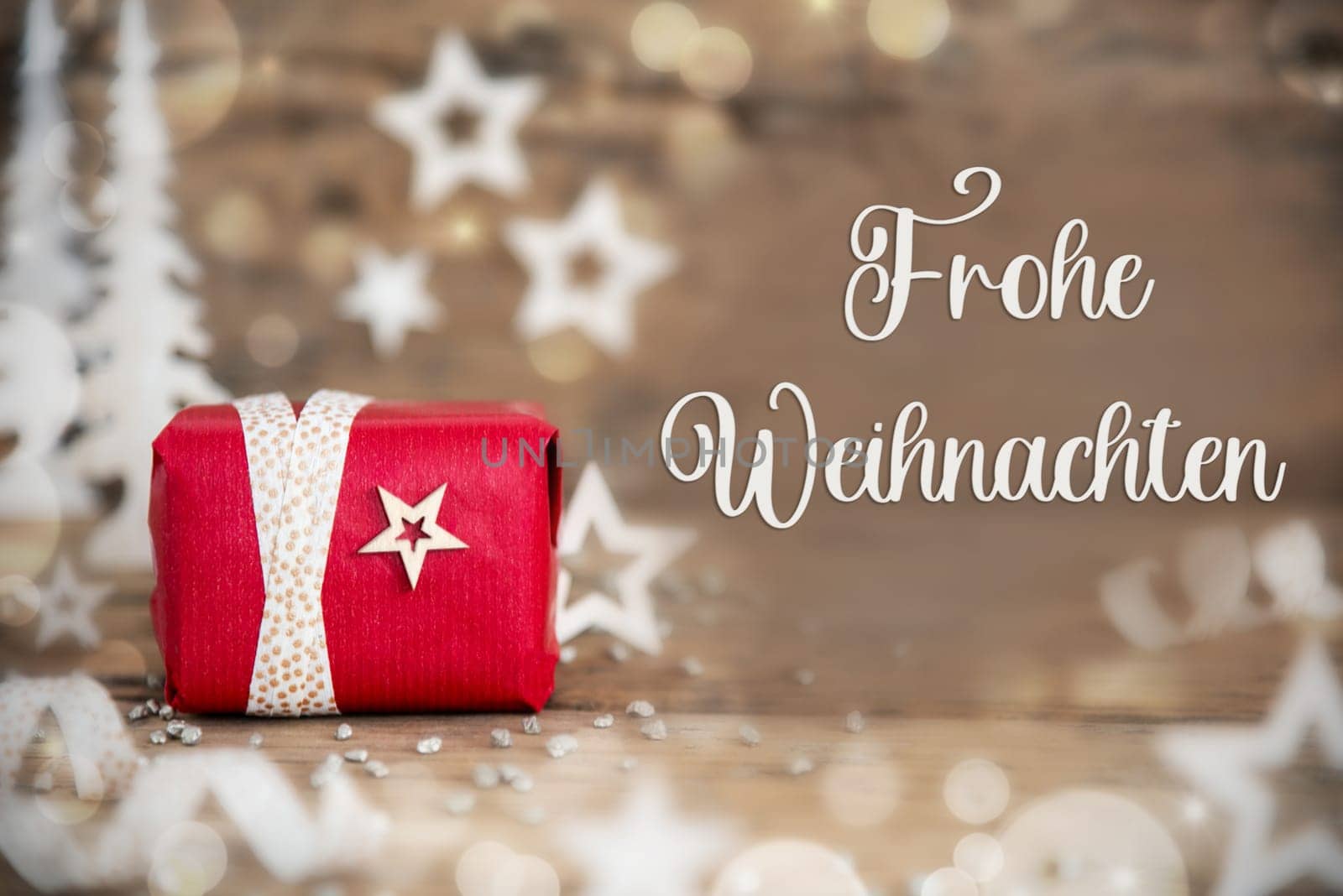 German Text Frohe Weihnachten, Means Merry Christmas In English, With Christmas Gift, Wooden Background, Stars, Winter or Christmas Decoration