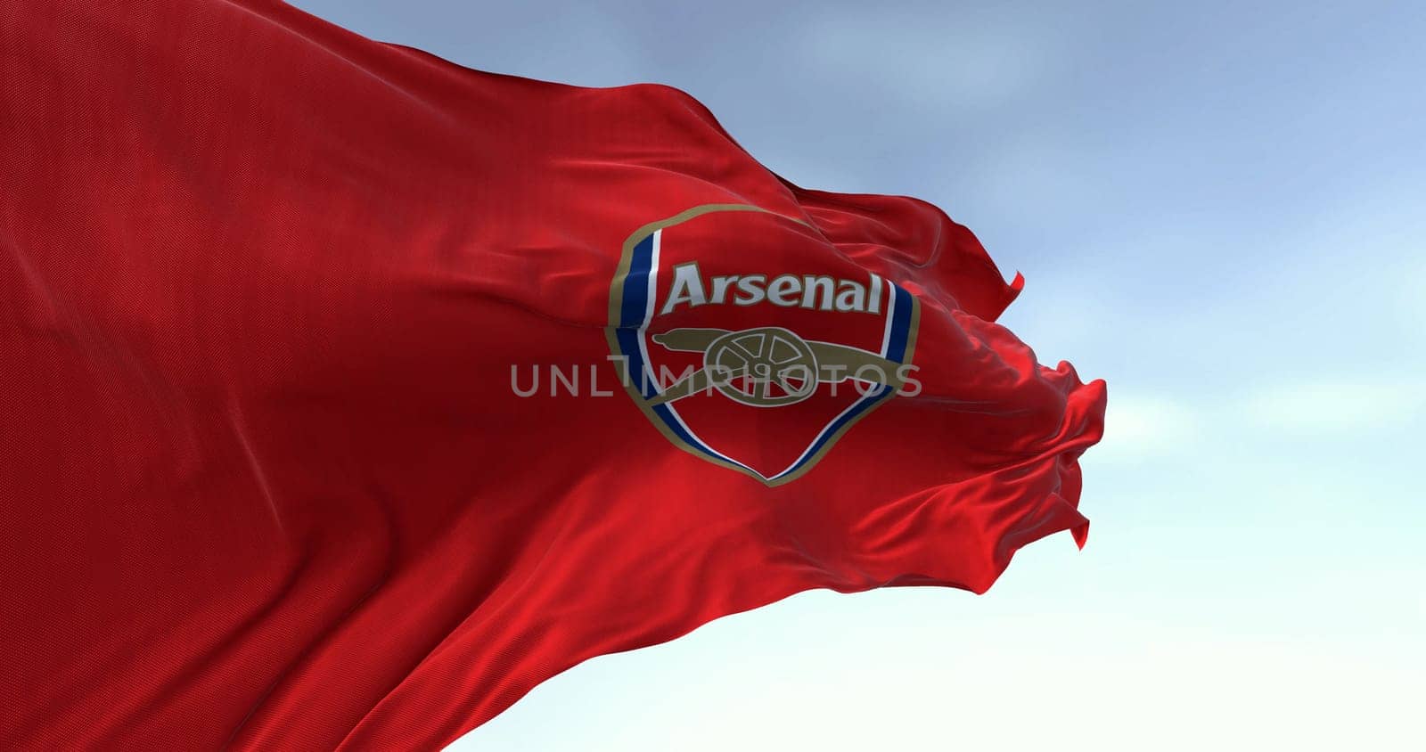 London, UK, oct. 15 2023: Close-up of Arsenal football club waving on a clear day. English professional football club. Premier League. Illustrative editorial 3d illustration. Rippling fabric