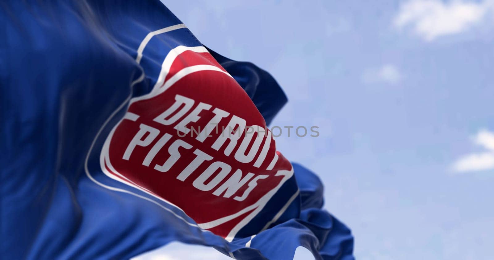 Detroit, US, Sept 10 2023: Detroit Pistons flag waving on a clear day. American professional basketball team, Central Division of the Eastern Conference. Illustrative editorial 3d illustration render