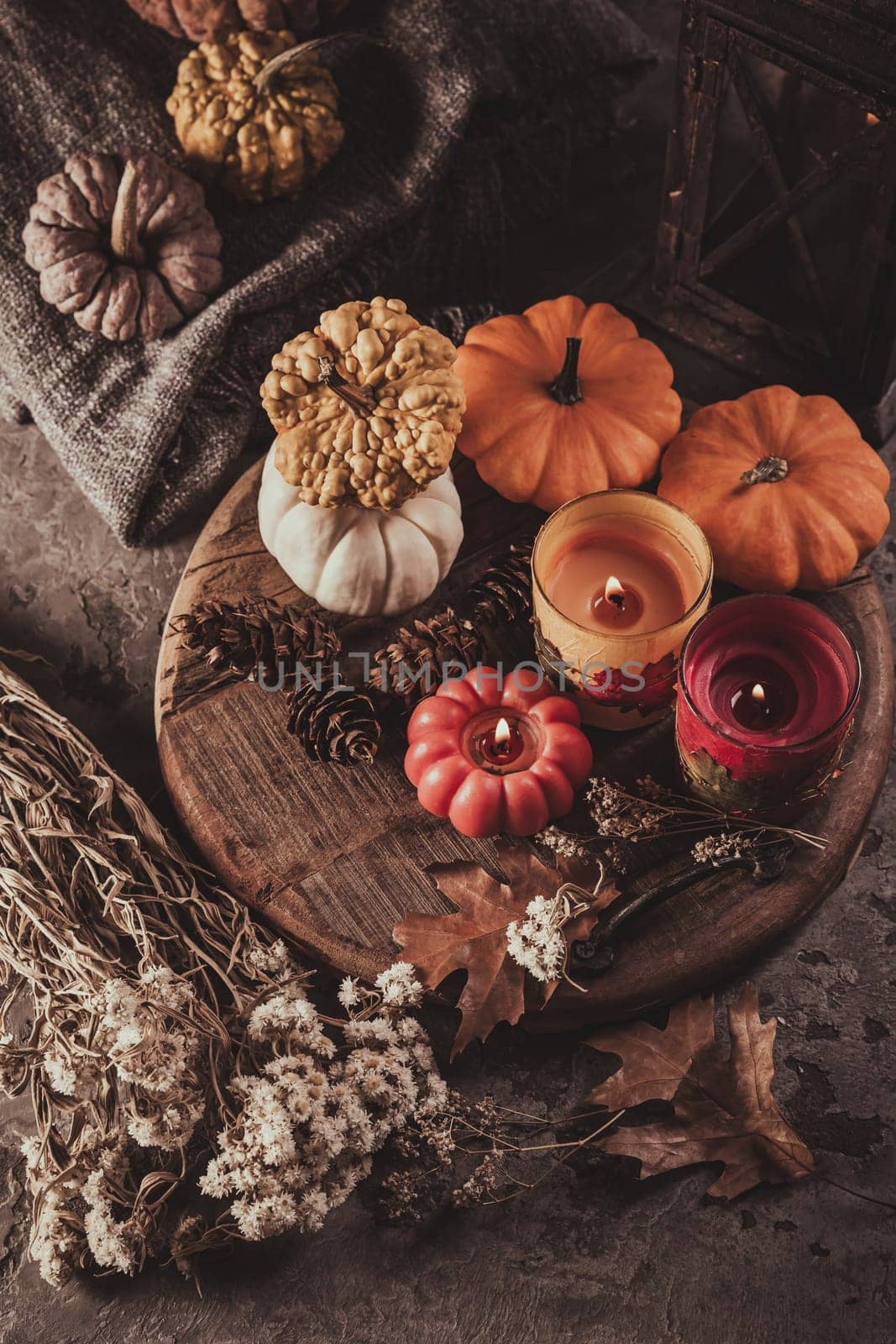 Home decoration with pumpkins and candles for Thanksgiving and Halloween