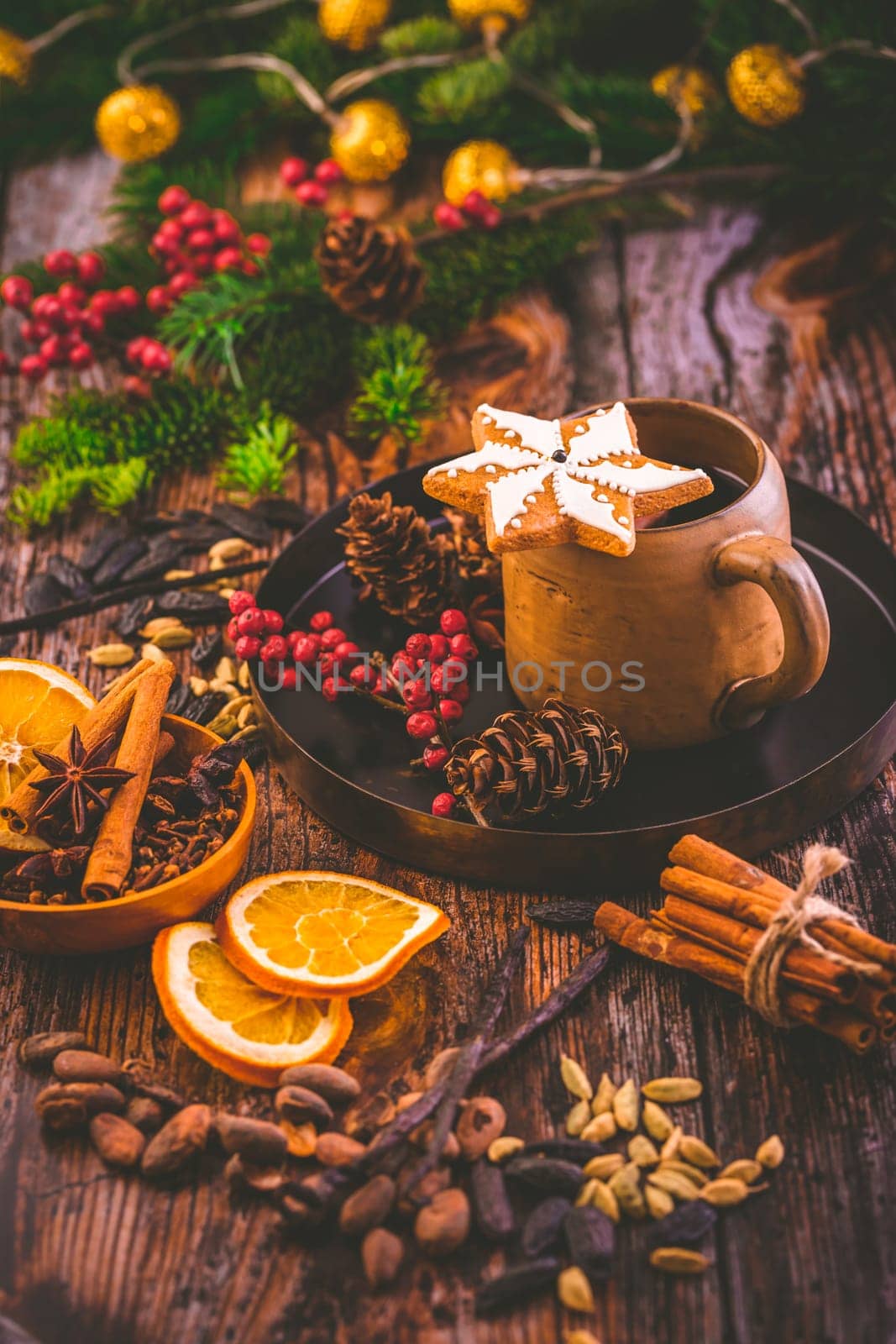 Christmas mulled red wine with spices and citrus fruits and gingerbread cookie