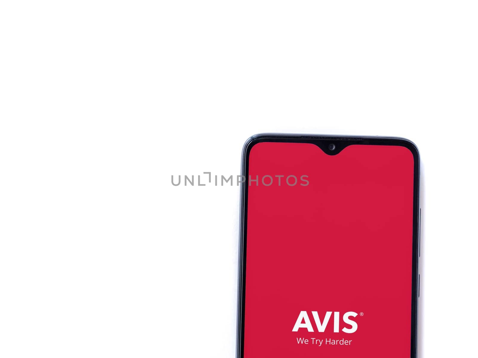 Lod, Israel - July 16,2023: Avis IL app launch screen on smartphone on white background. Top view flat lay with copy space.