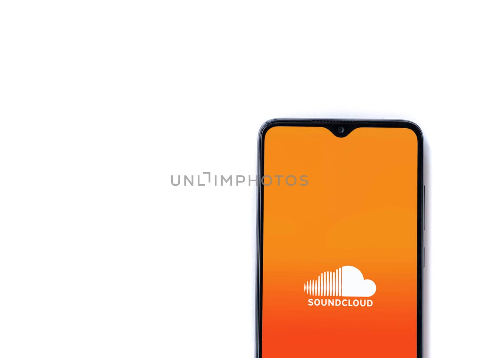 Lod, Israel - July 16,2023: SoundCloud app launch screen on smartphone on white background. Top view flat lay with copy space.
