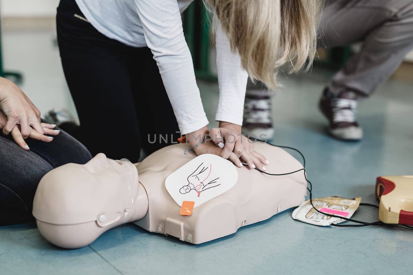 First aid cardiopulmonary resuscitation course using automated external defibrillator device, AED.