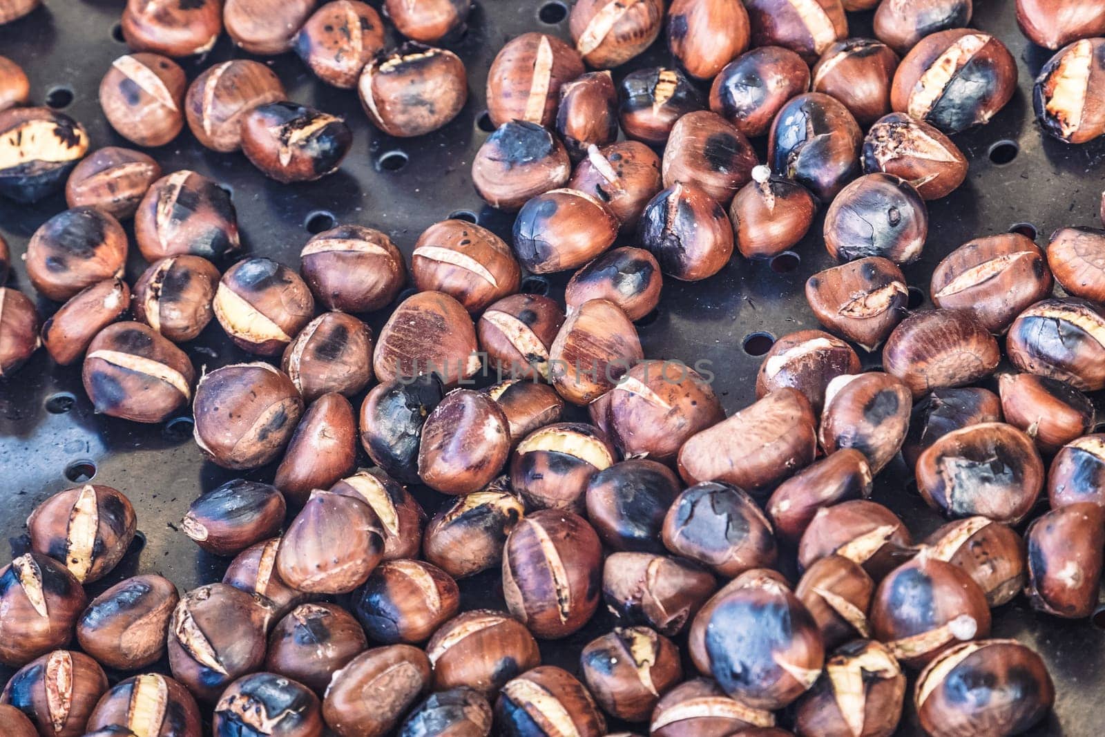 Grilled chestnuts being selled at stalls in autumn.