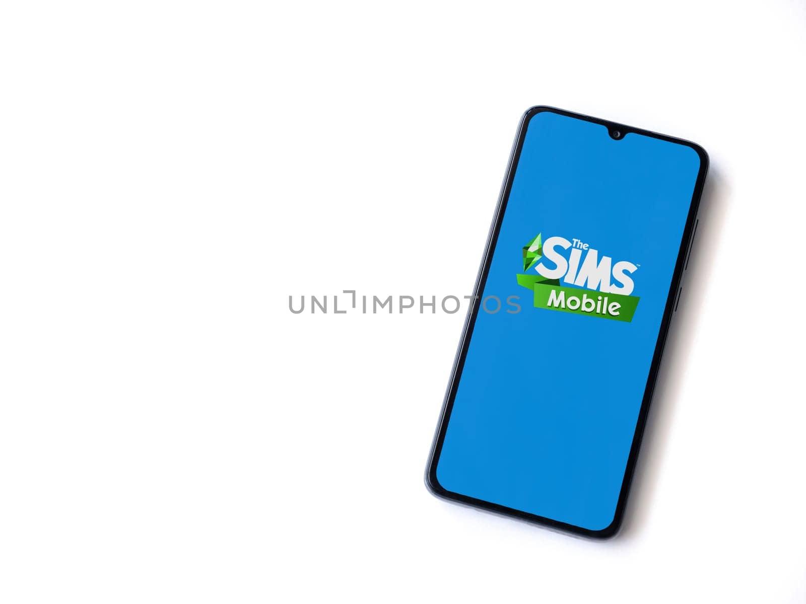 Lod, Israel - July 16,2023: The Sims Mobile app launch screen on smartphone on white background. Top view flat lay with copy space.
