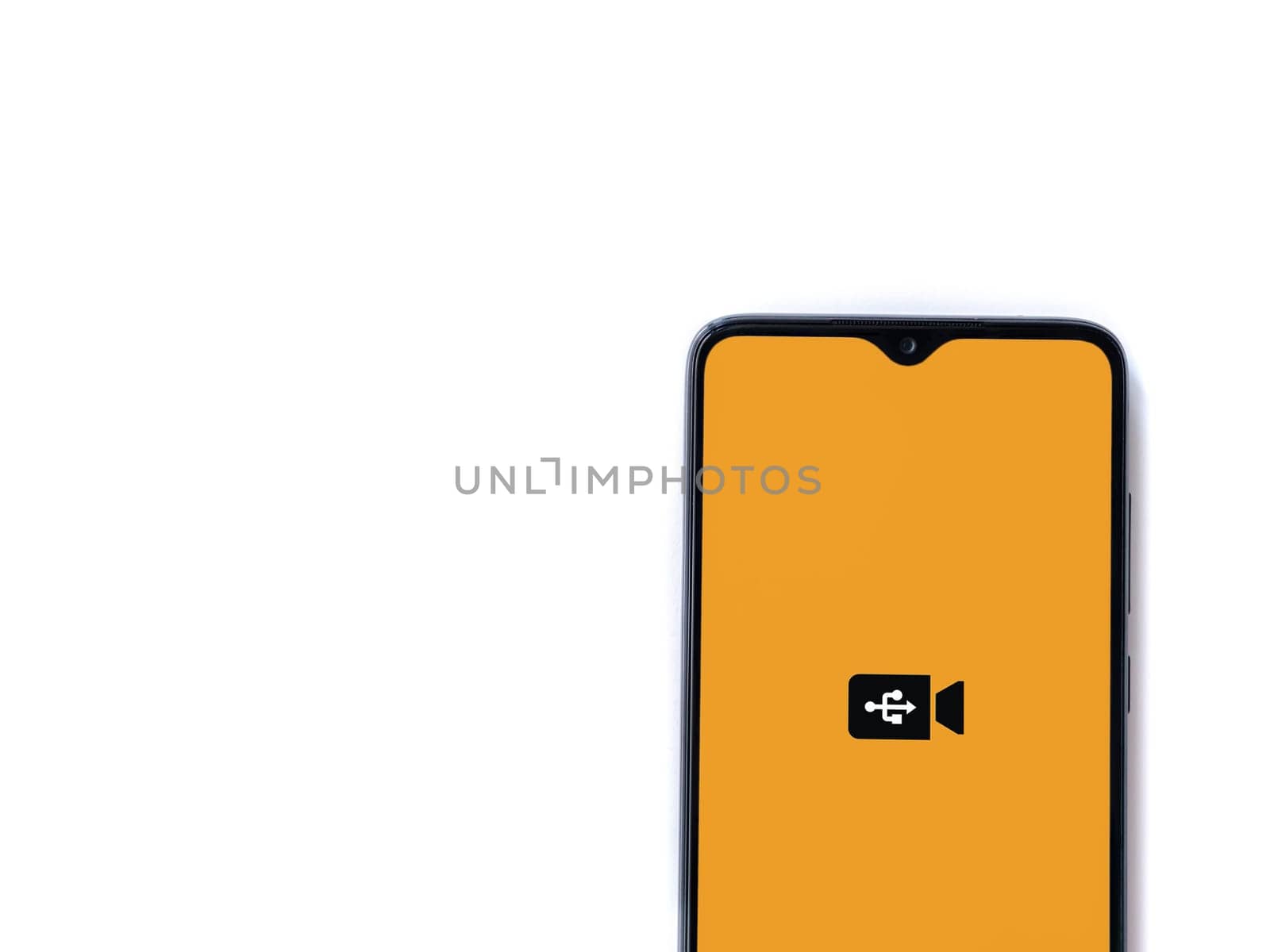 Lod, Israel - July 16,2023: USB Camera app launch screen on smartphone on white background. Top view flat lay with copy space.