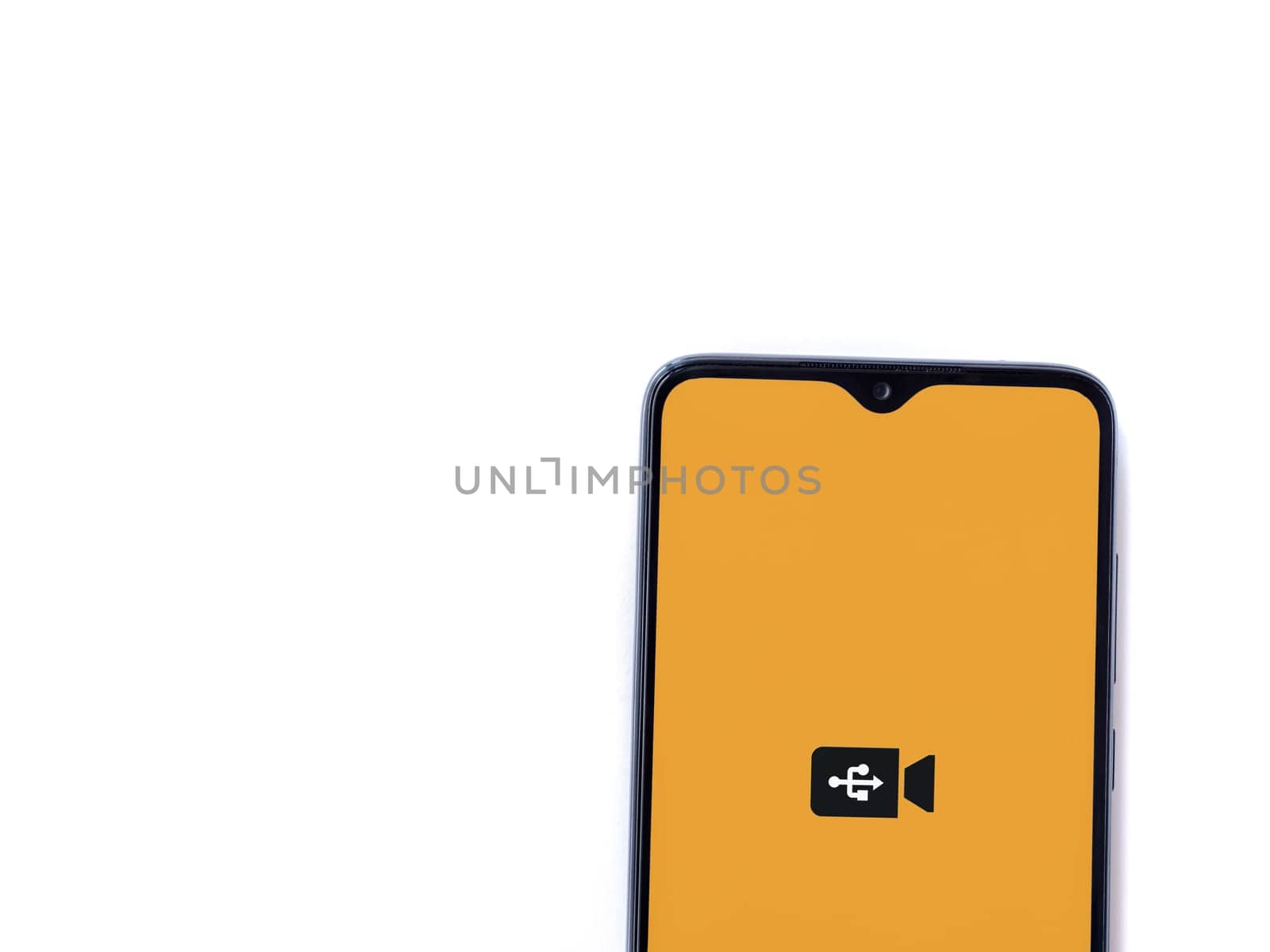 Lod, Israel - July 16,2023: USB Camera app launch screen on smartphone on white background. Top view flat lay with copy space.