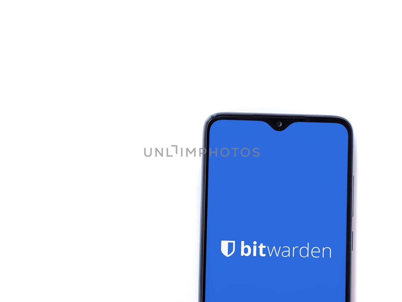 Lod, Israel - July 16,2023: Bitwarden Password Manager app launch screen on smartphone on white background. Top view flat lay with copy space.