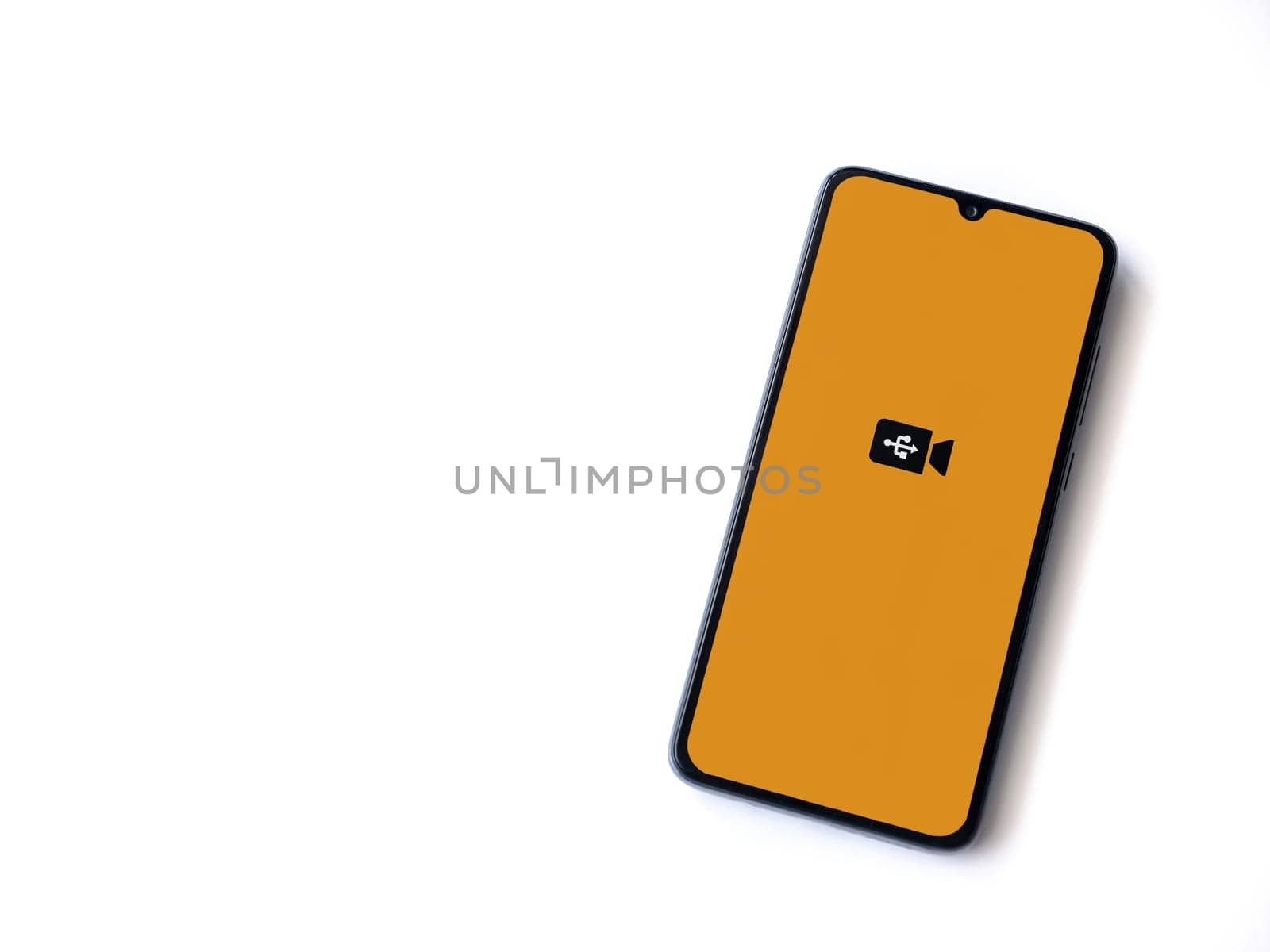 Lod, Israel - July 16,2023: USB Camera app launch screen on smartphone on white background. Top view flat lay with copy space.