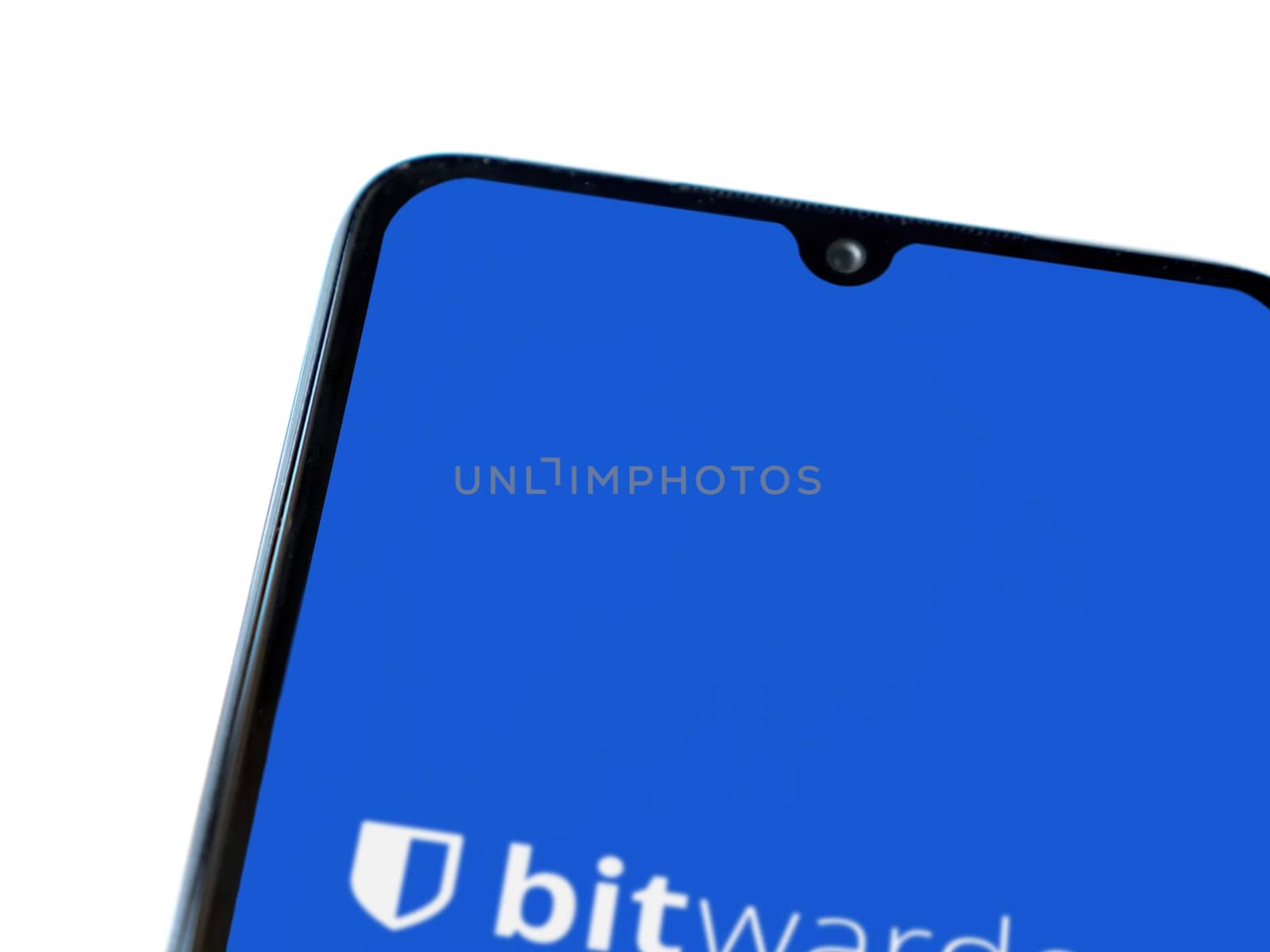 Lod, Israel - July 16,2023: Bitwarden Password Manager app launch screen on smartphone on white background. Top view flat lay with copy space.