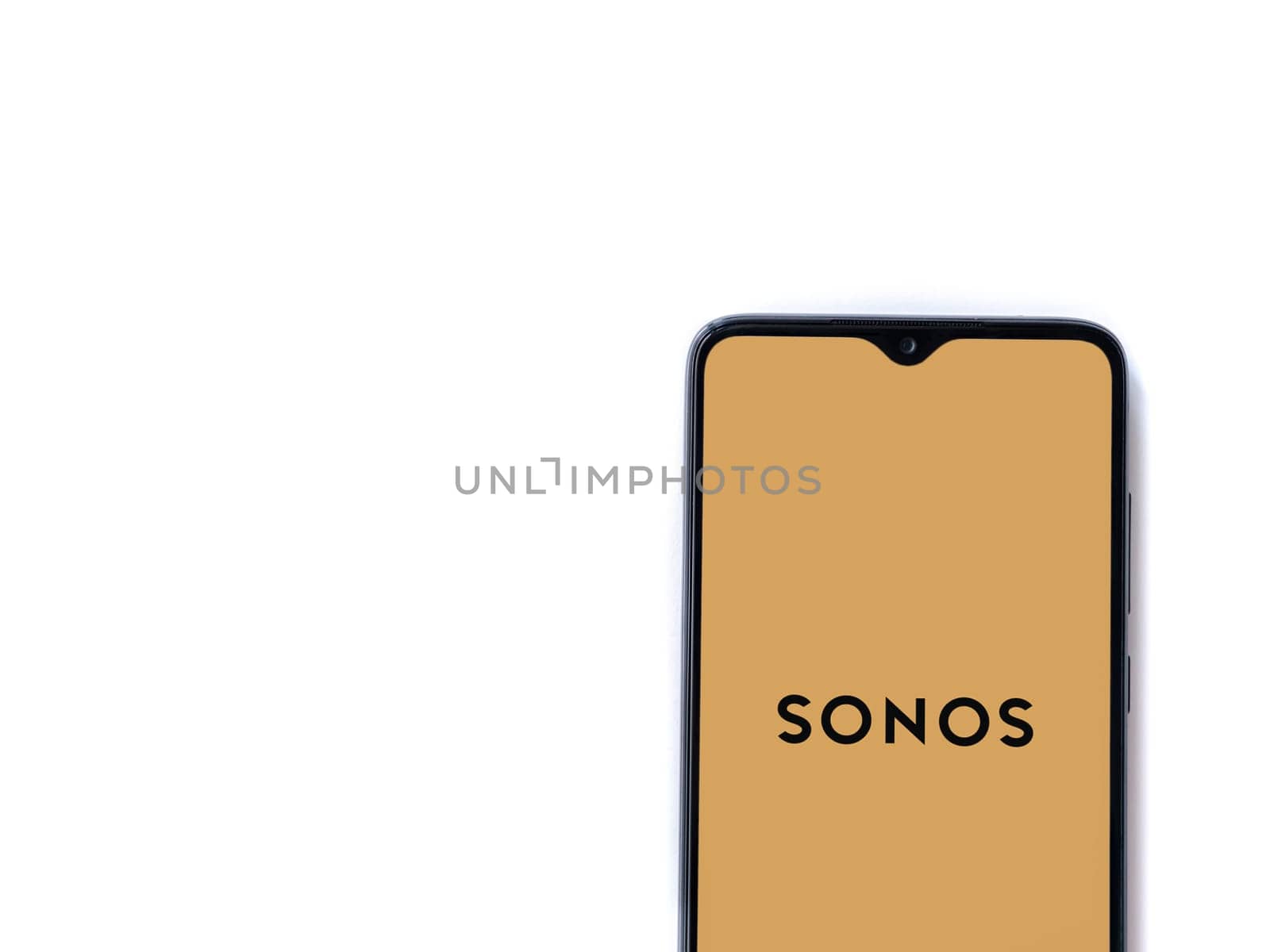 Lod, Israel - July 16,2023: Sonos app launch screen on smartphone on white background. Top view flat lay with copy space.
