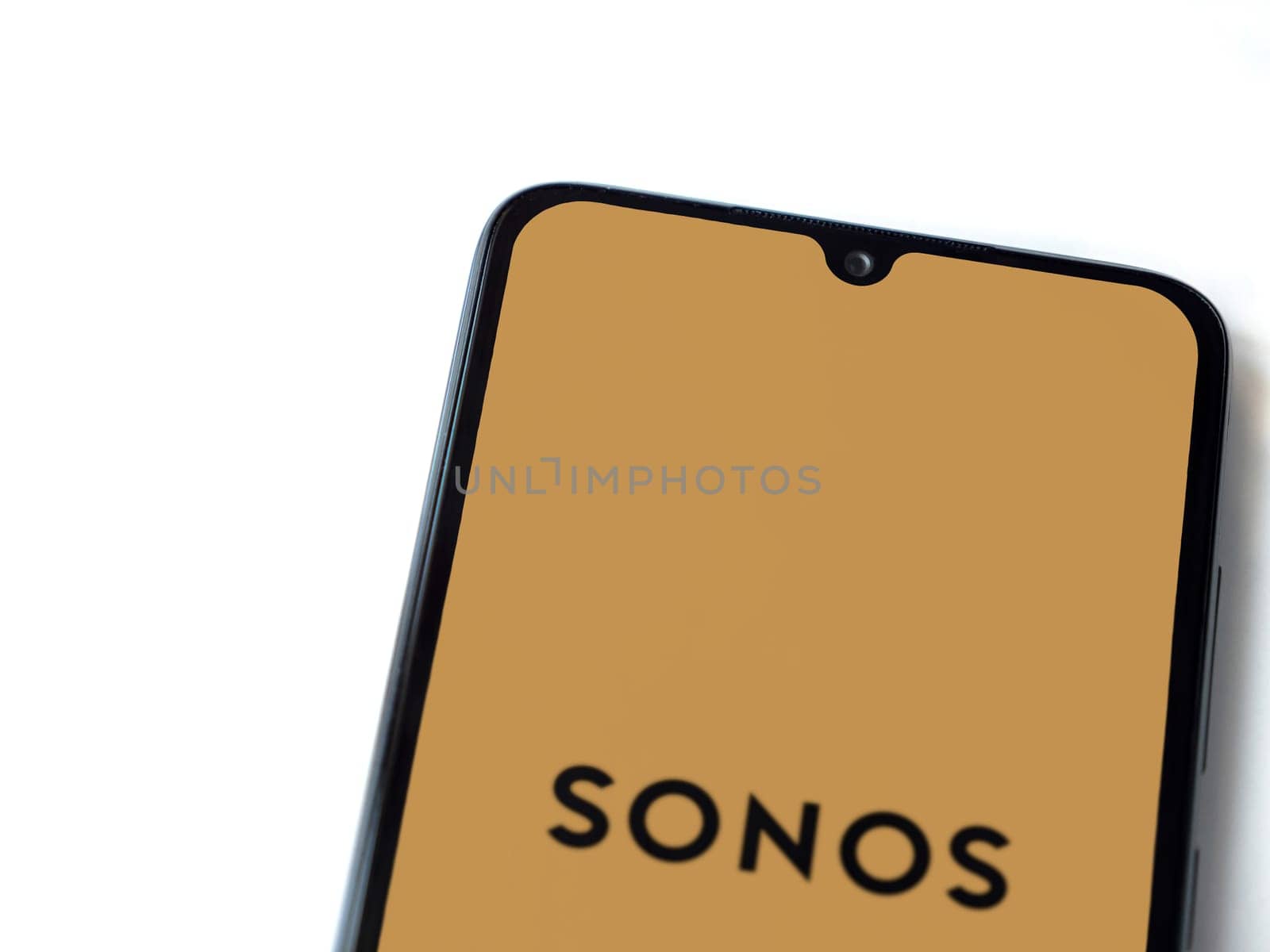 Lod, Israel - July 16,2023: Sonos app launch screen on smartphone on white background. Top view flat lay with copy space.