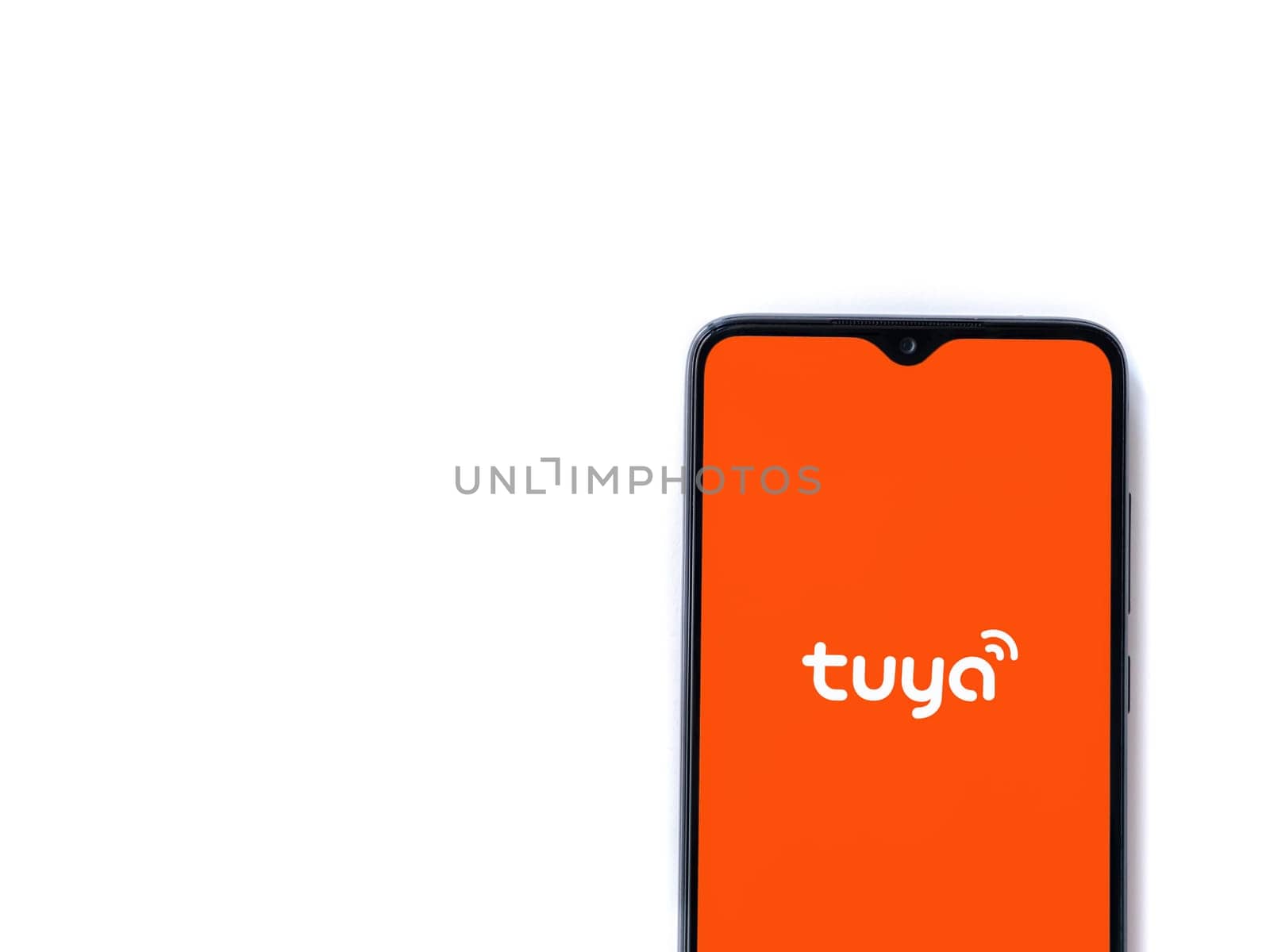 Lod, Israel - July 16,2023: Tuya Smart app launch screen on smartphone on white background. Top view flat lay with copy space.