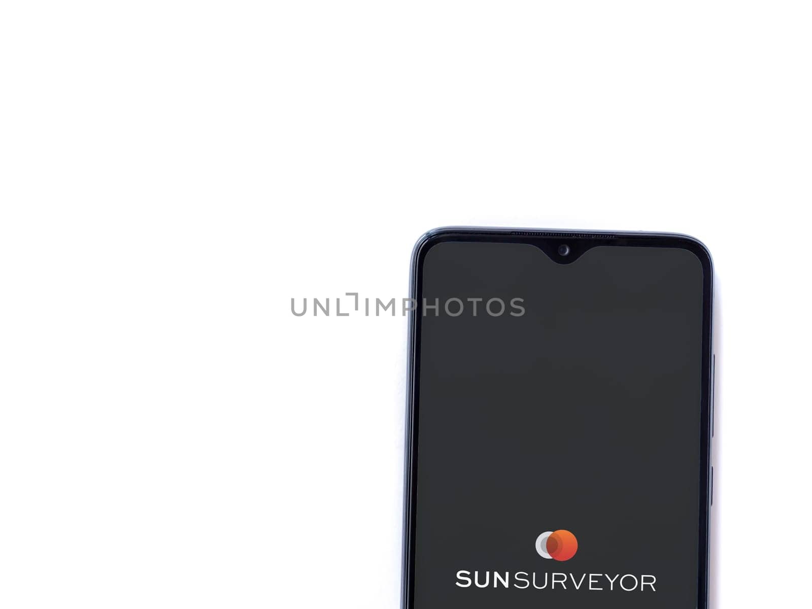 Lod, Israel - July 16,2023: Sun Surveyor app launch screen on smartphone on white background. Top view flat lay with copy space.
