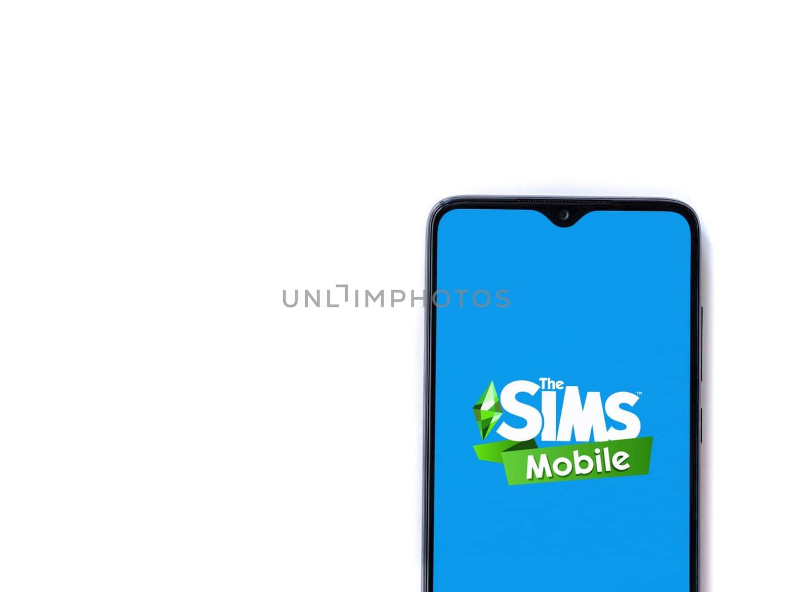 Lod, Israel - July 16,2023: The Sims Mobile app launch screen on smartphone on white background. Top view flat lay with copy space.