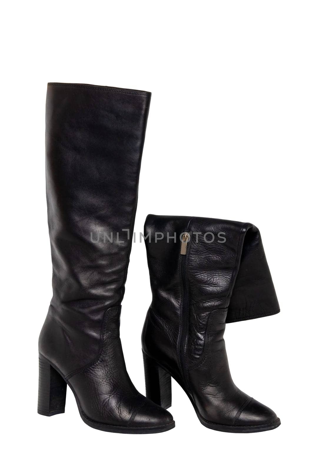 A pair of black elegant female boots or woman shoes isolated on a white background. Leather boots. Clipping path.