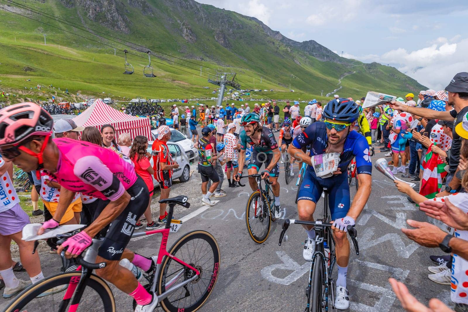 Col du Tourmalet, France - July 06 2023: Riders climbig the road to Col du Tourmalet in Pyerenees mountains during the stage 6 of Le Tour de France 2023.