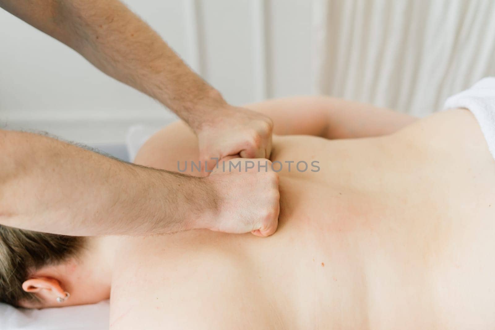 Anti-cellulite foot massage for fat woman. Concept of personal care, weight loss, diet. Close-up.