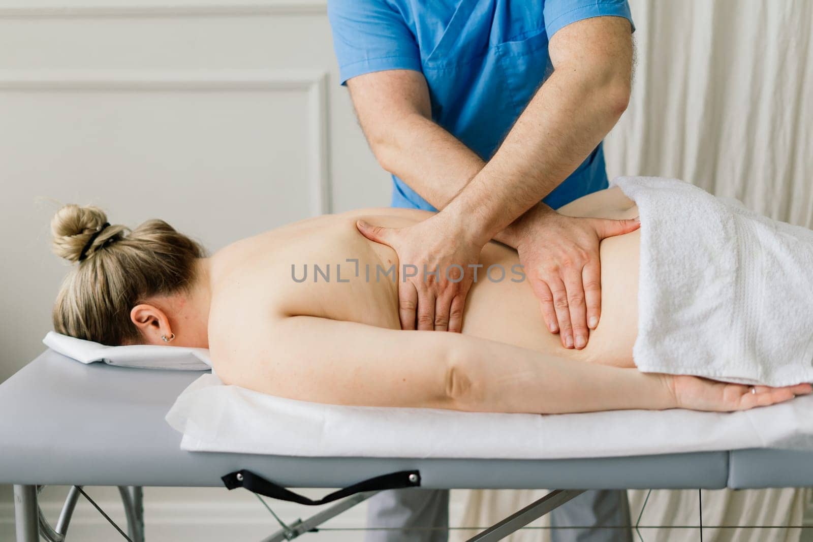 Anti-cellulite foot massage for fat woman. Concept of personal care, weight loss, diet. Close-up.