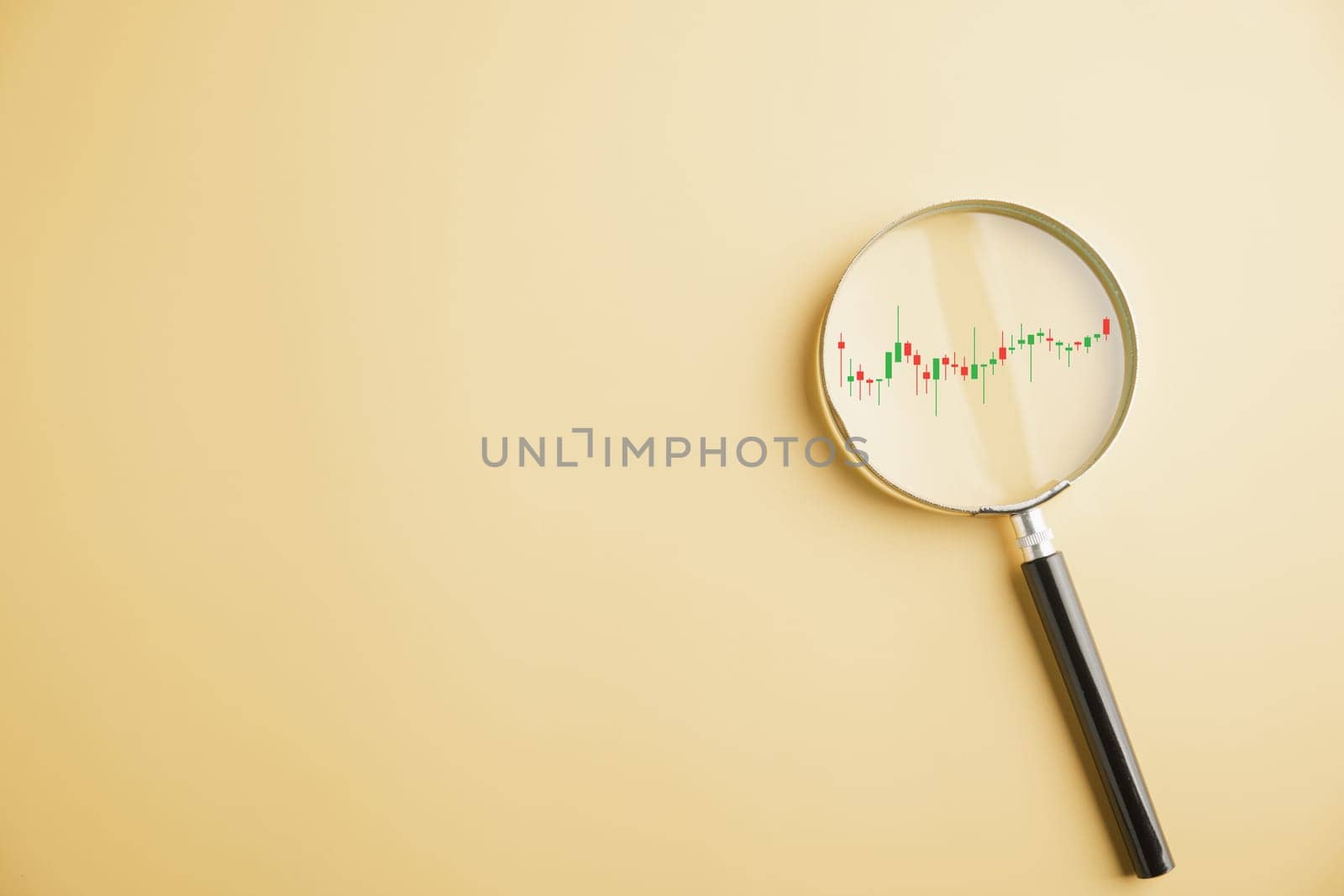 A trader's magnifying glass reveals insights into stock market's bar graph, highlighting upward trend and reflecting potential for profitable business investments. Technical price graph and indicator
