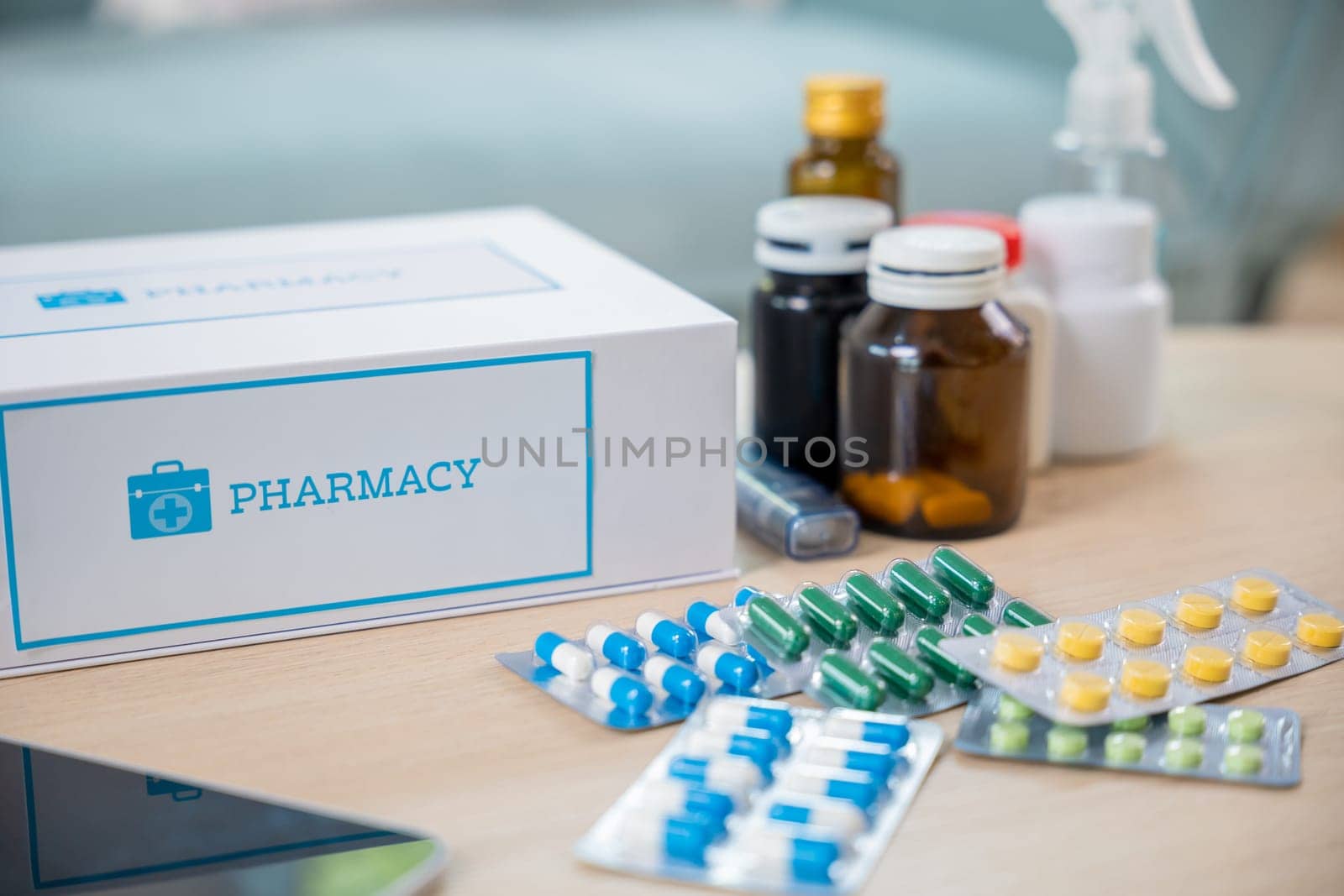 Home medicine with medicine package box free first aid kit with pills from pharmacy hospital delivery service at home on table in living room, online purchase delivery of medicines to your home