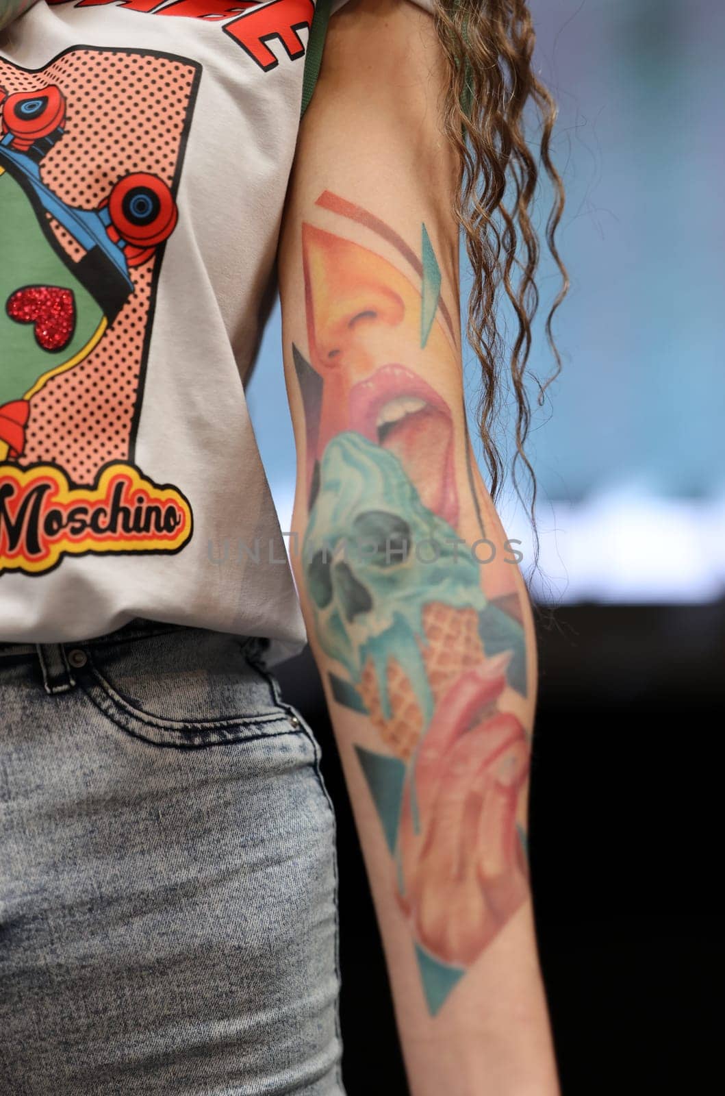 Krakow, Poland - June 12, 2022: Unidentified participant during the contest for the best tattoo at the 15th Tattoofest Convention in Cracow. One of the most prestigious tattoo festivals.