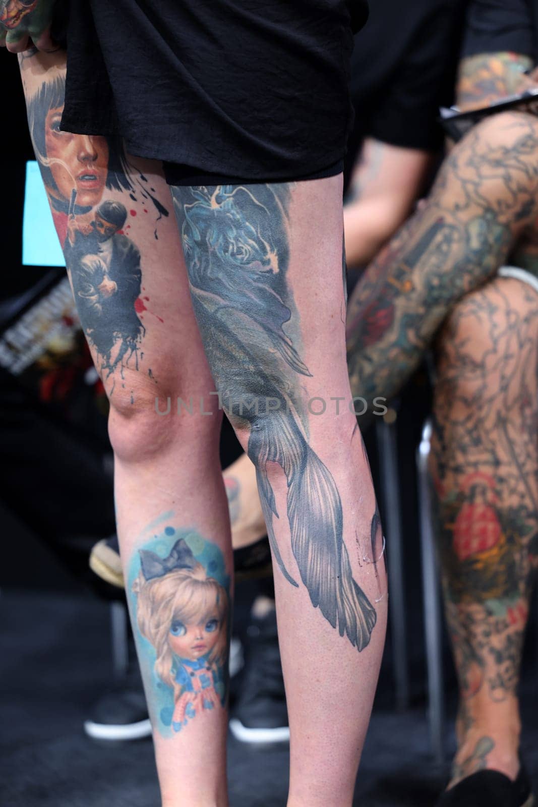 Krakow, Poland - June 12, 2022: Unidentified participant during the contest for the best tattoo at the 15th Tattoofest Convention in Cracow. One of the most prestigious tattoo festivals.