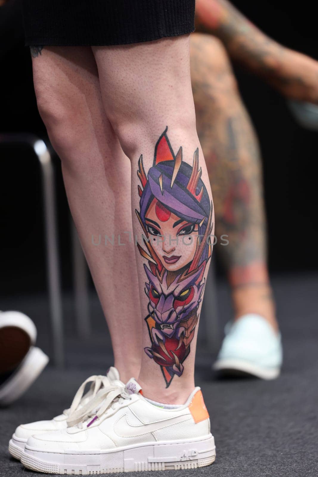 Krakow, Poland - June 11, 2022: Unidentified participant during the contest for the best tattoo at the 15th Tattoofest Convention in Cracow. One of the most prestigious tattoo festivals.