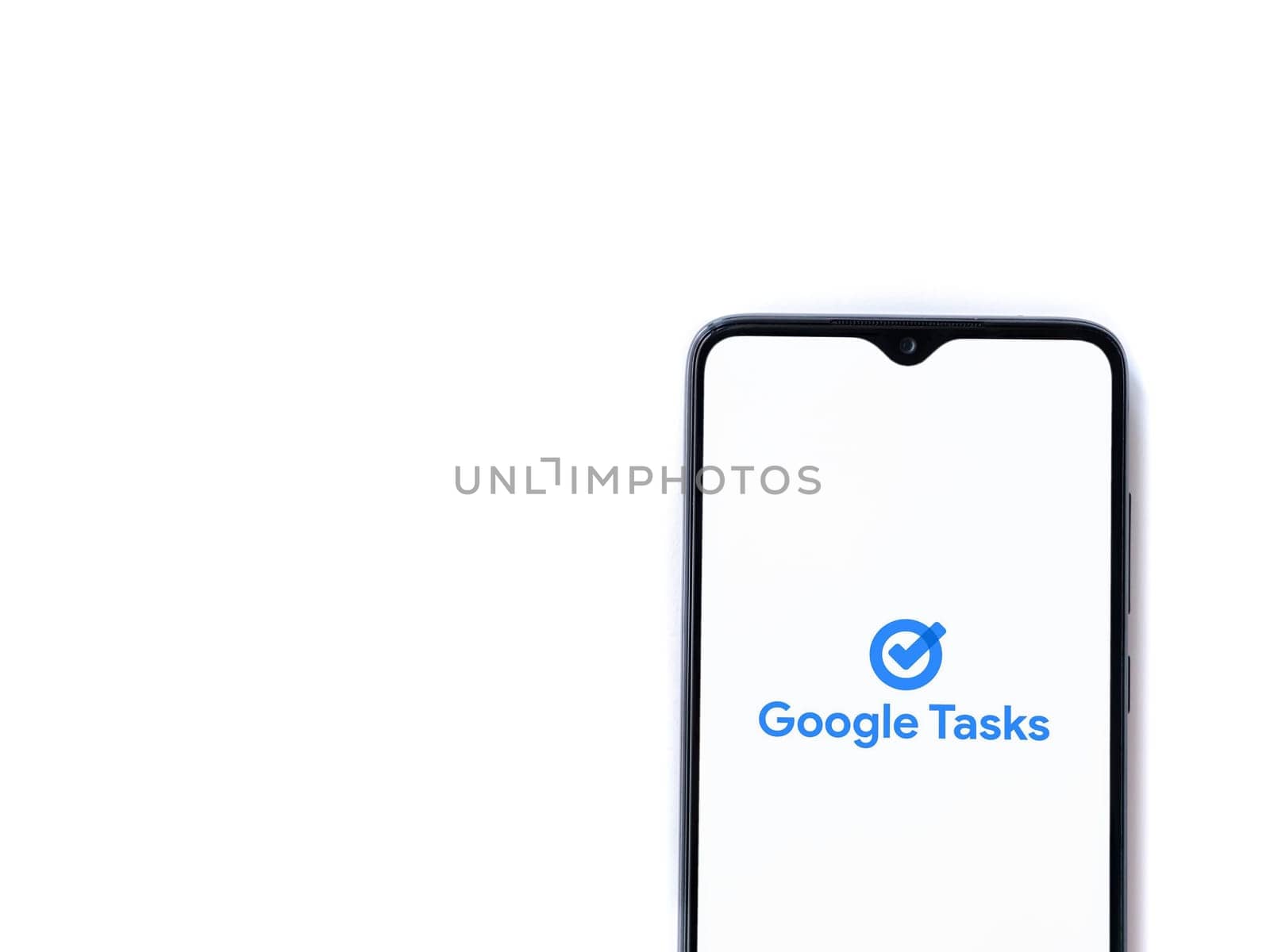 Lod, Israel - July 16,2023: Google Task app launch screen on smartphone on white background. Top view flat lay with copy space.