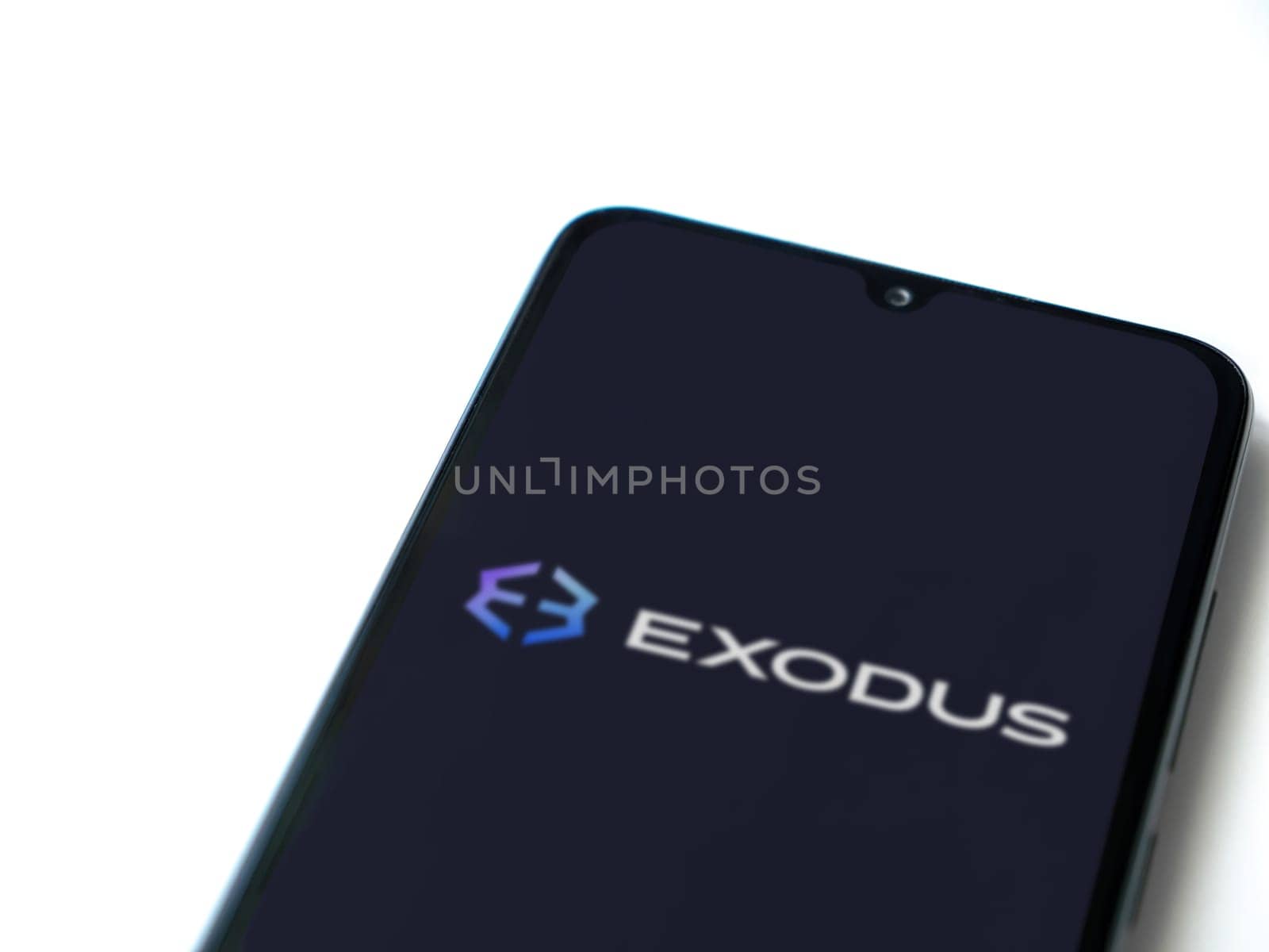Lod, Israel - July 16,2023: Exodus app launch screen on smartphone on white background. Top view flat lay with copy space.