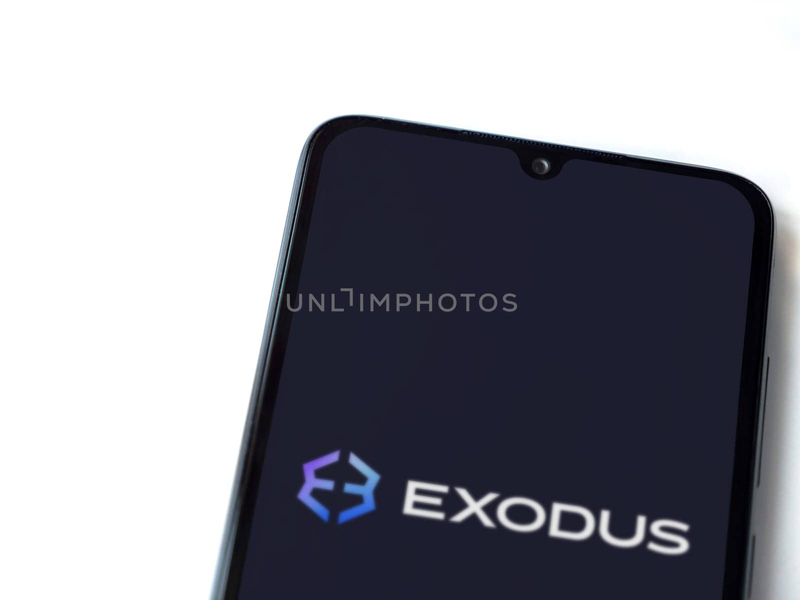 Lod, Israel - July 16,2023: Exodus app launch screen on smartphone on white background. Top view flat lay with copy space.