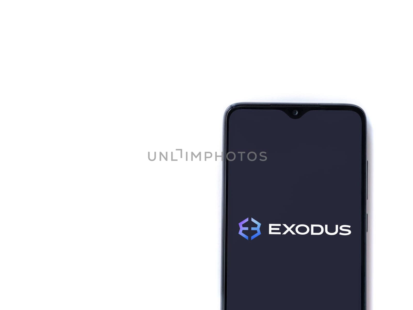 Lod, Israel - July 16,2023: Exodus app launch screen on smartphone on white background. Top view flat lay with copy space.