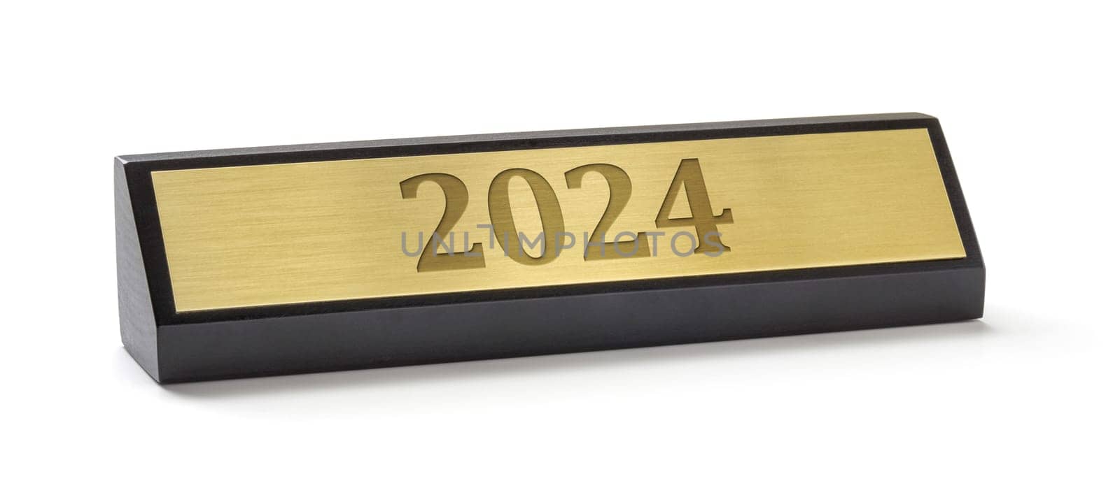 A name plate on a white background with the engraving 2024