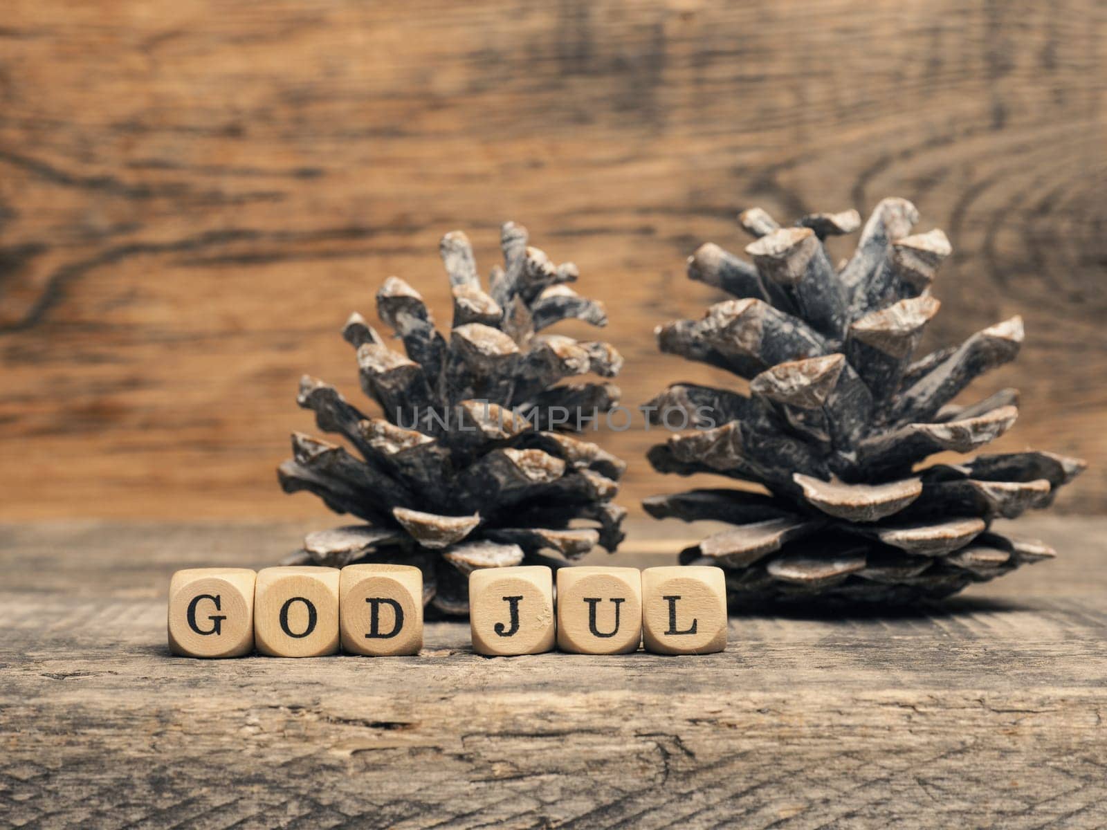 Scandinavian Merry Christmas with wooden blocks and the inscrption God Jul
