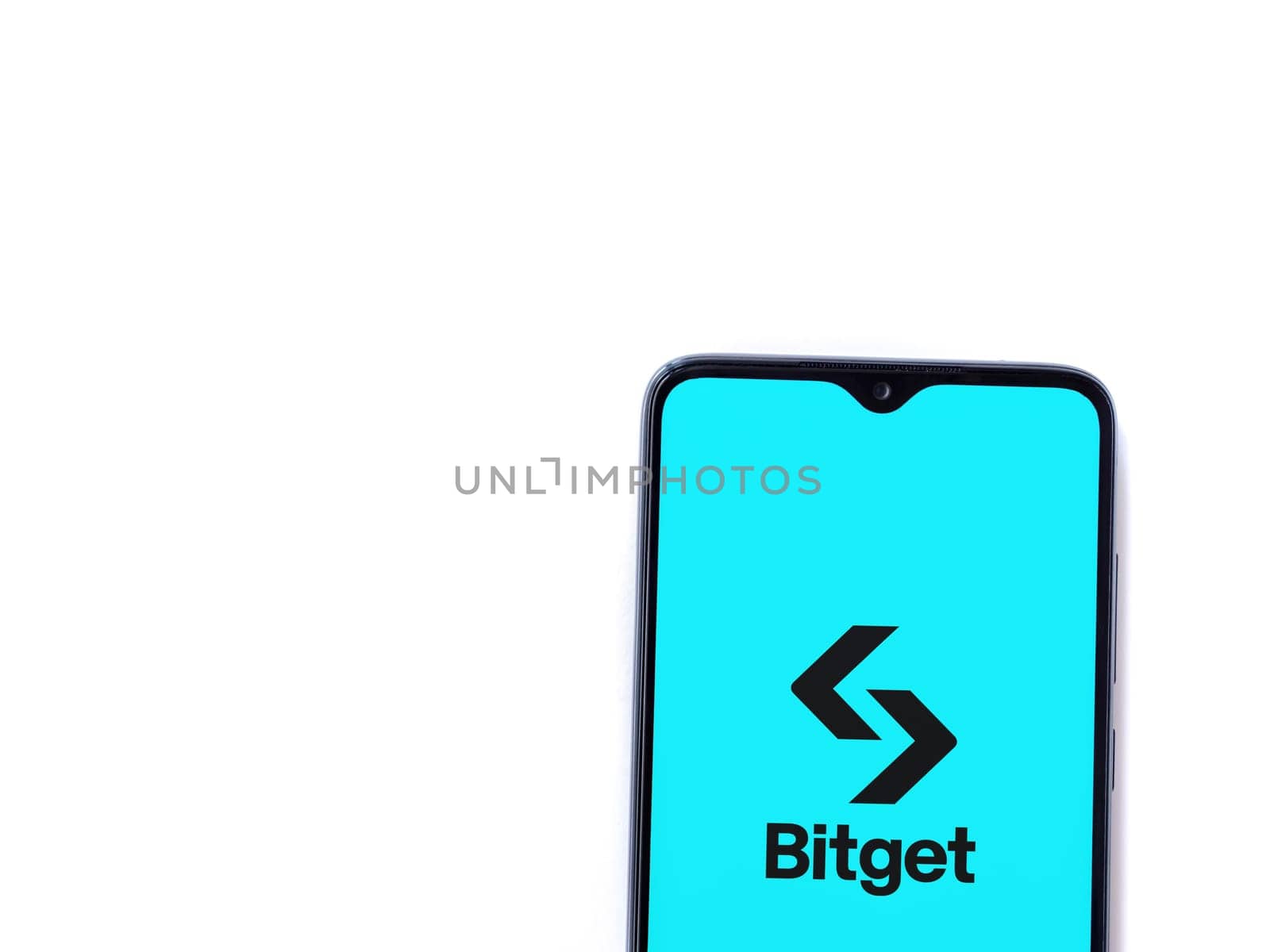 Lod, Israel - July 16,2023: Bitget app launch screen on smartphone on white background. Top view flat lay with copy space.