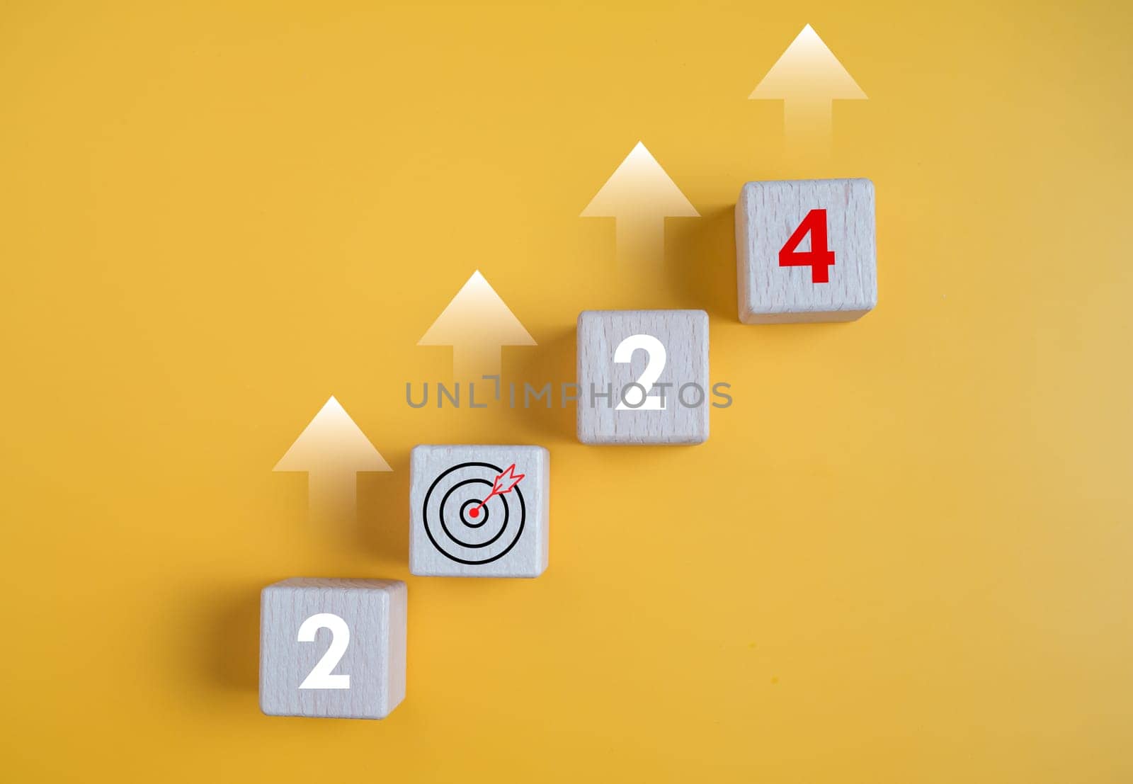 Wooden blocks lined up with the letters 2024. Represents the goal setting for 2024, the concept of a start and financial planning development strategy business goal setting