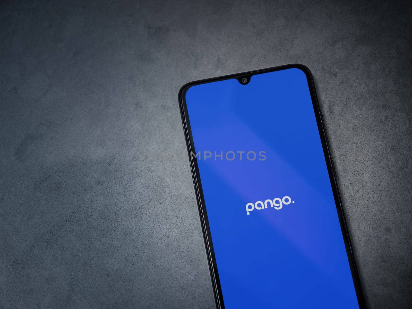 Lod, Israel - July 16,2023: Pango app launch screen on smartphone on dark marble stone background. Top view flat lay with copy space.