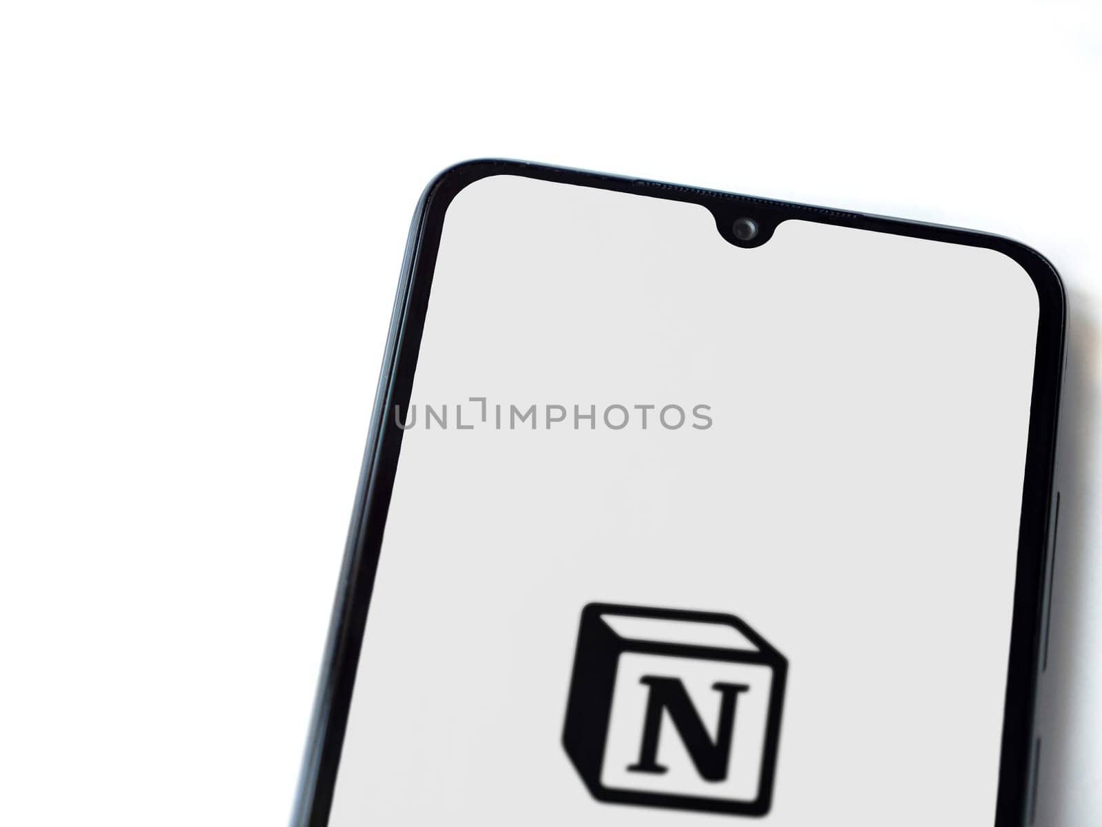 Lod, Israel - July 16,2023: Notion app launch screen on smartphone on white background. Top view flat lay with copy space.