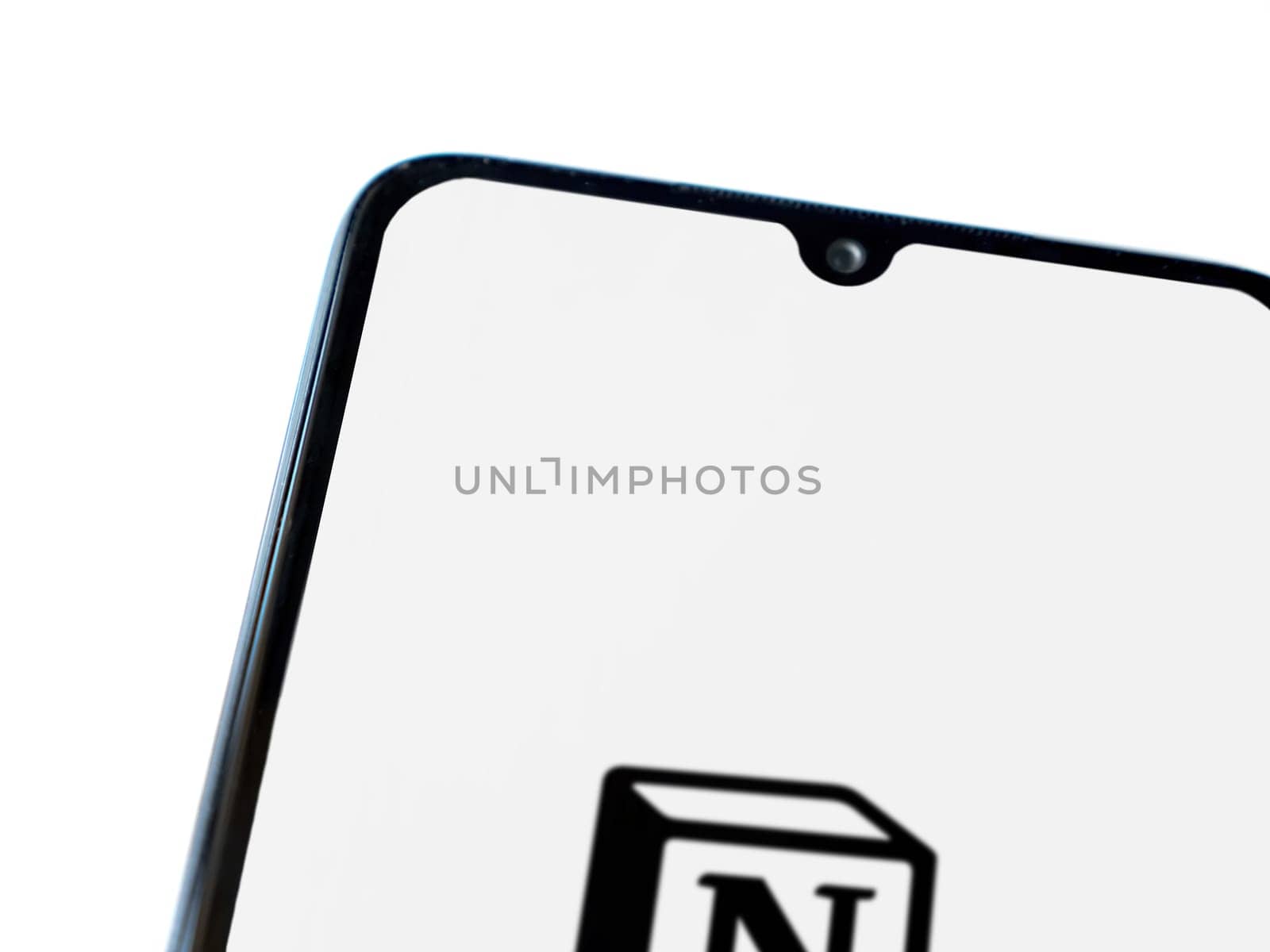 Lod, Israel - July 16,2023: Notion app launch screen on smartphone on white background. Top view flat lay with copy space.