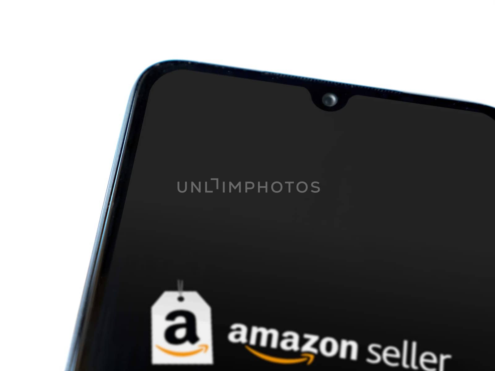Lod, Israel - July 16,2023: Amazon Seller app launch screen on smartphone on white background. Top view flat lay with copy space.