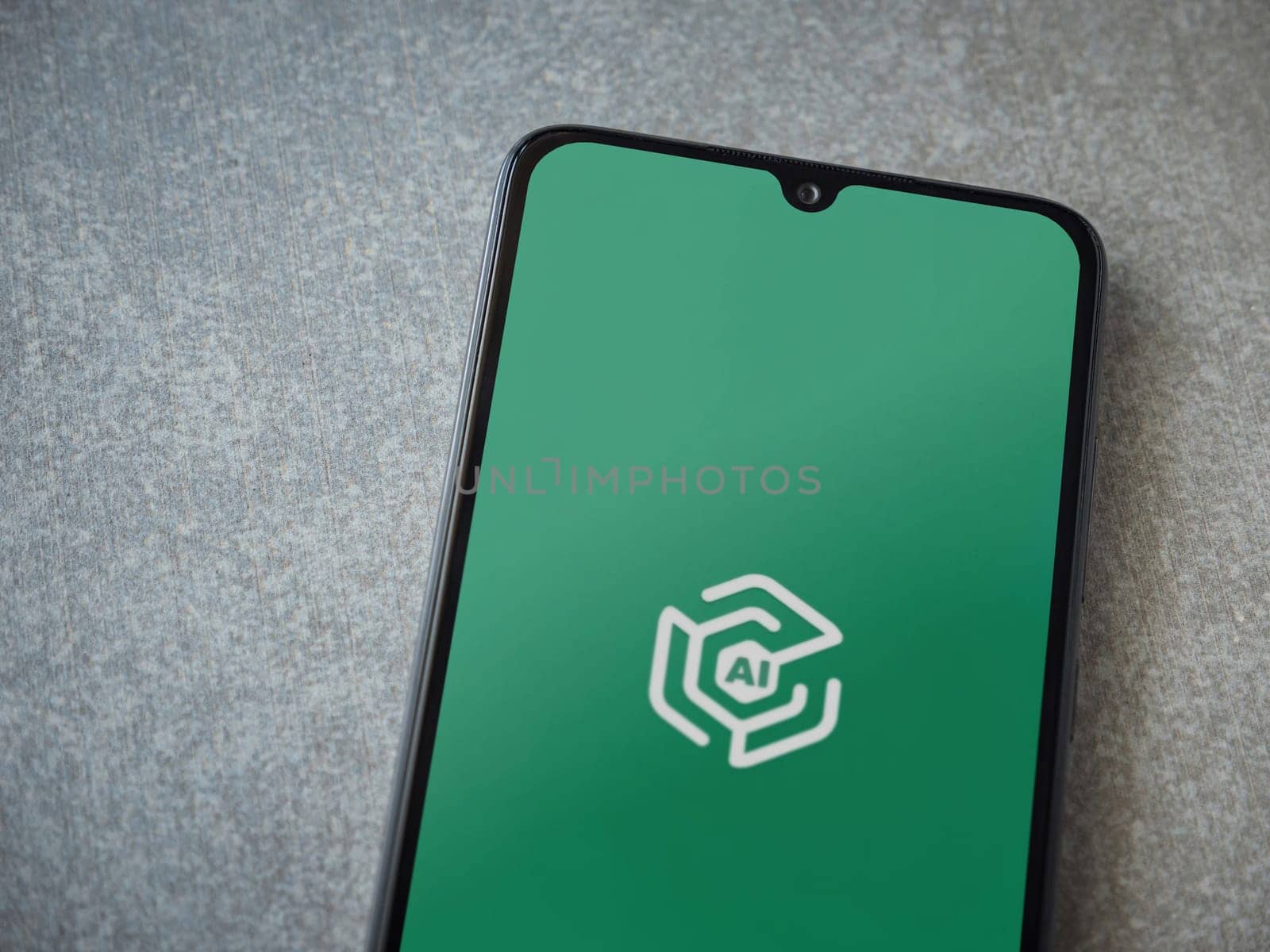Lod, Israel - July 16,2023: Adam Ai app launch screen on smartphone on ceramic stone background. Top view flat lay with copy space.