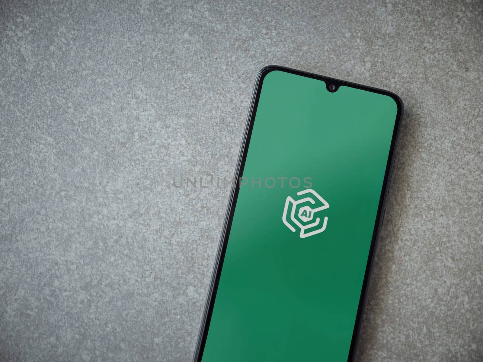 Lod, Israel - July 16,2023: Adam Ai app launch screen on smartphone on ceramic stone background. Top view flat lay with copy space.