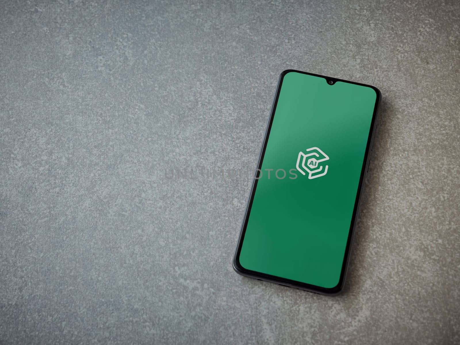 Lod, Israel - July 16,2023: Adam Ai app launch screen on smartphone on ceramic stone background. Top view flat lay with copy space.