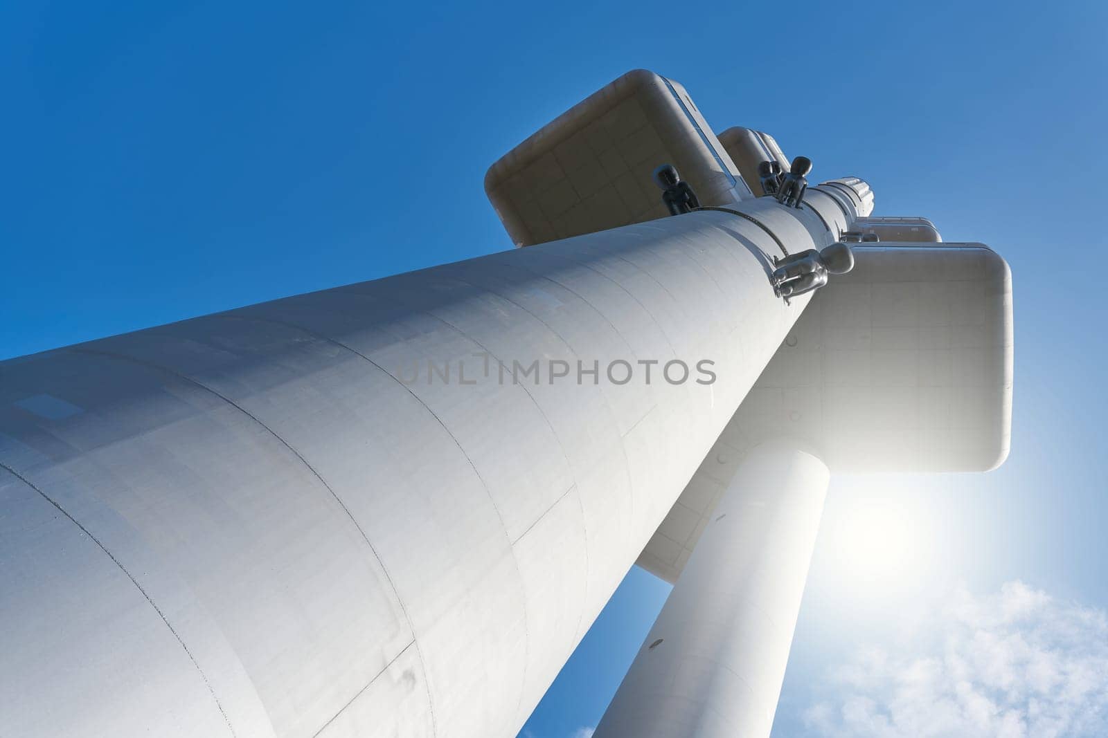 The TV tower in the Žižkov district of Prague in blinding sunlight with view from below